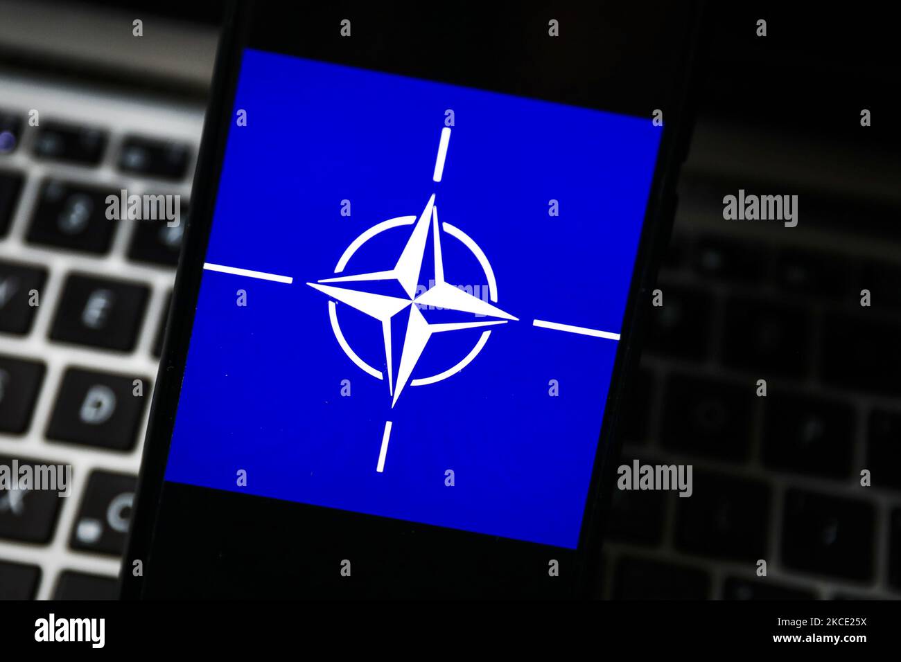 NATO logo is displayed on a mobile phone screen photographed for illustration photo. Gliwice, Poland on May 5, 2021. (Photo by Beata Zawrzel/NurPhoto) Stock Photo