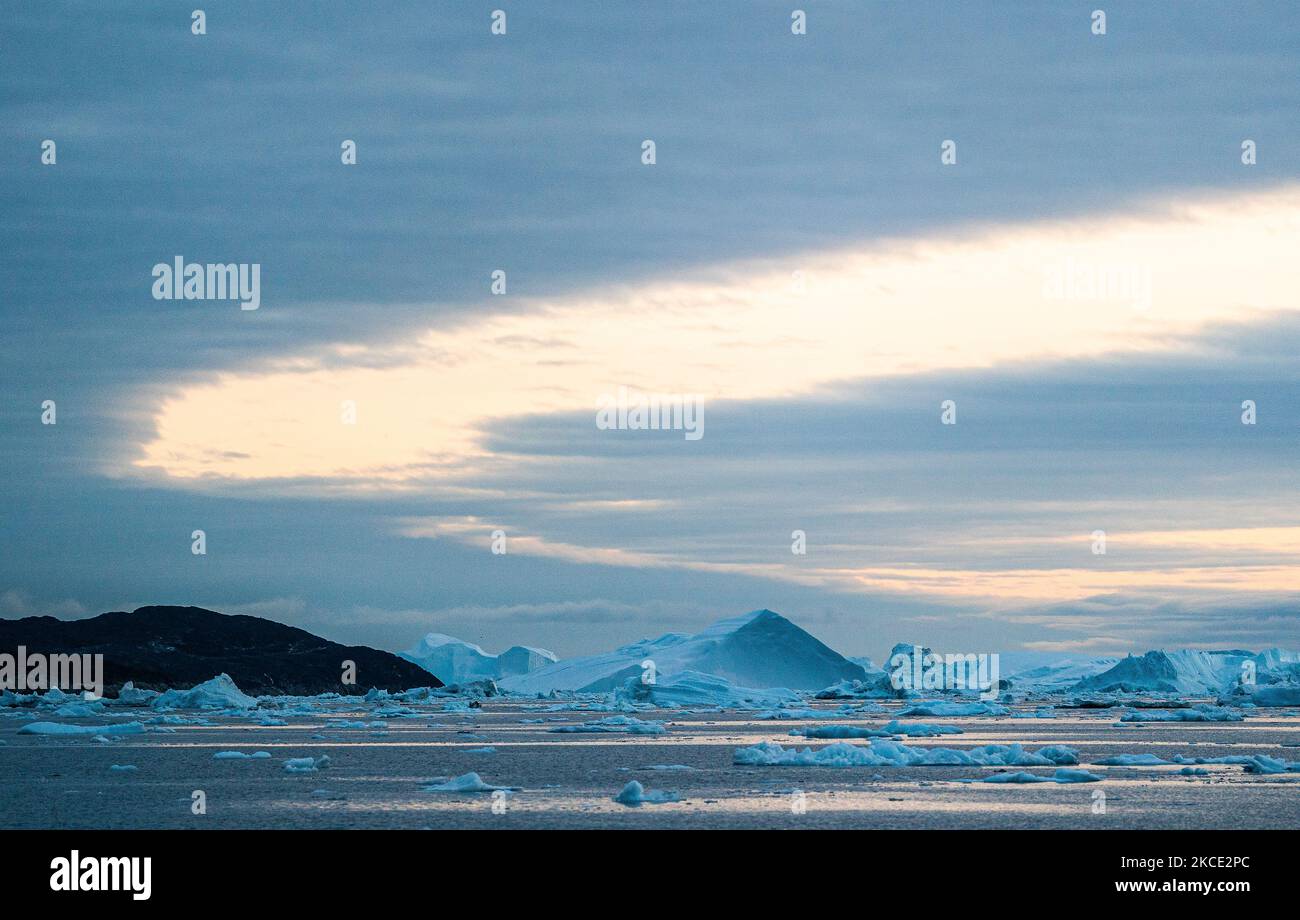 Icebergs near Ilulissat, Greenland. Climate change is having a profound ...
