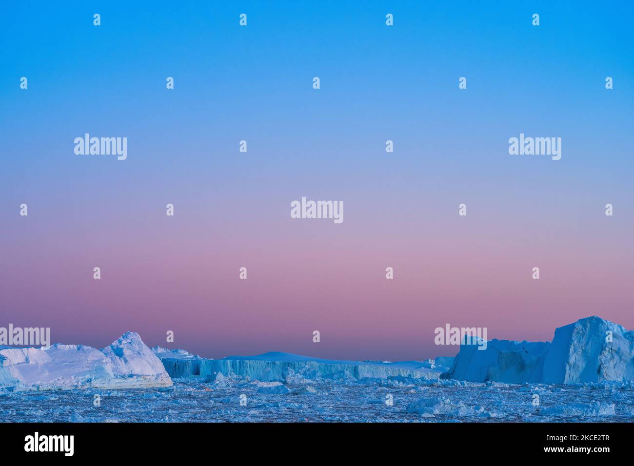 Icebergs near Ilulissat, Greenland. Climate change is having a profound effect in Greenland with glaciers and the Greenland ice cap retreating. (Photo by Ulrik Pedersen/NurPhoto) Stock Photo