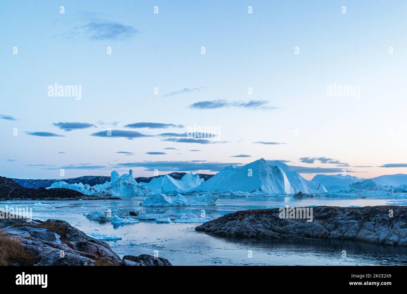 Icebergs near Ilulissat, Greenland. Climate change is having a profound ...
