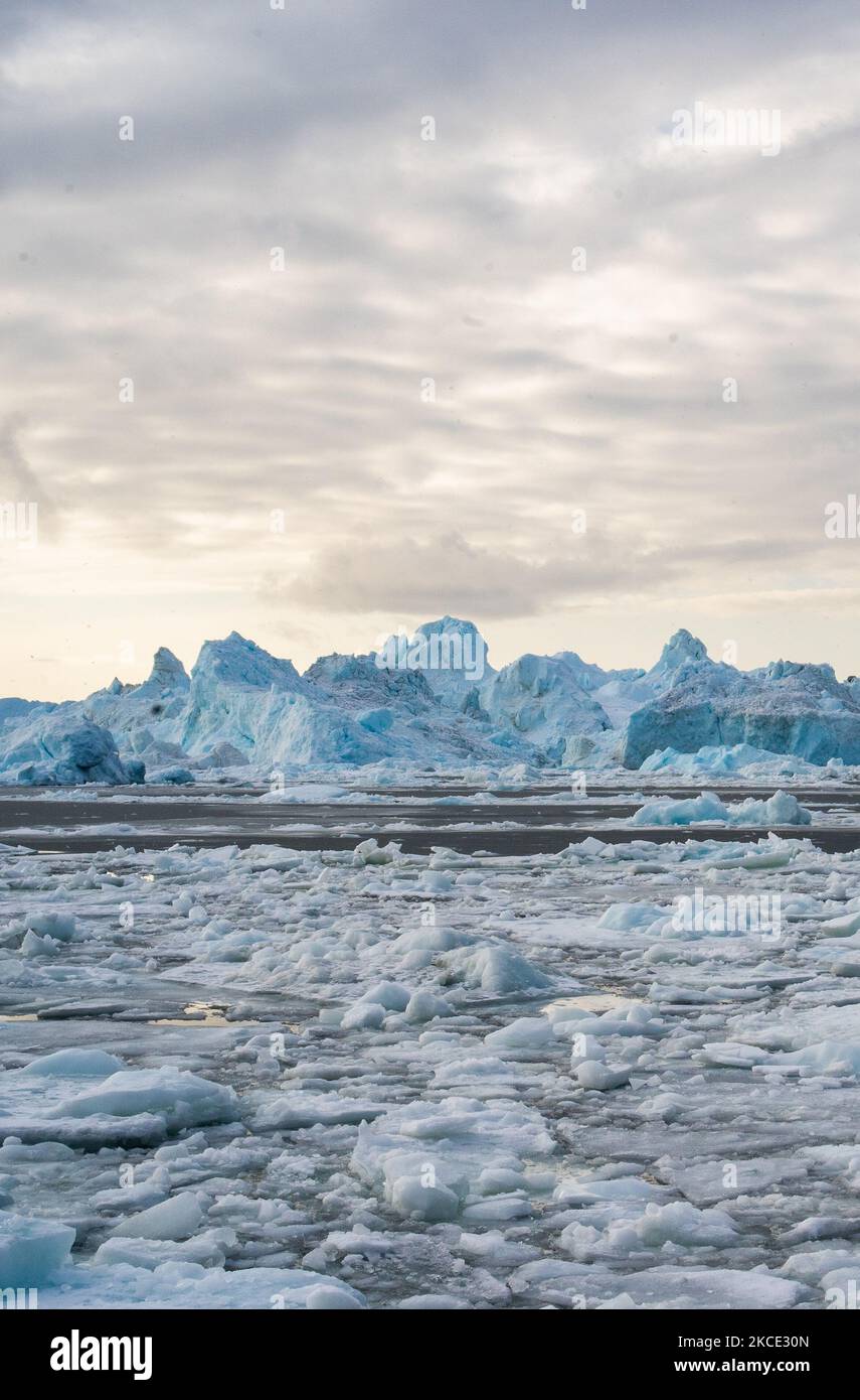Icebergs near Ilulissat, Greenland. Climate change is having a profound ...