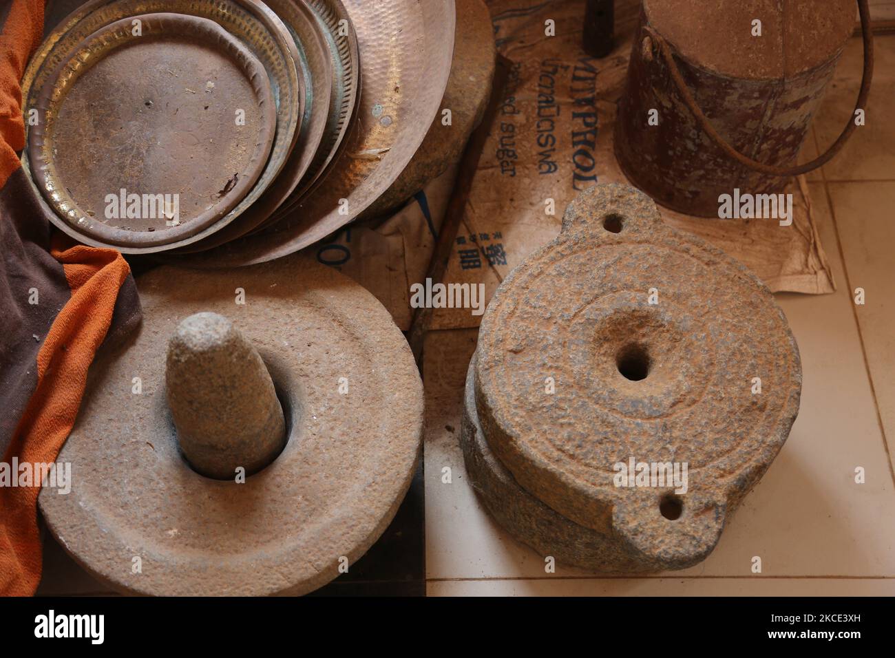 Traditional grinding stones displayed at an exhibition of Hindu