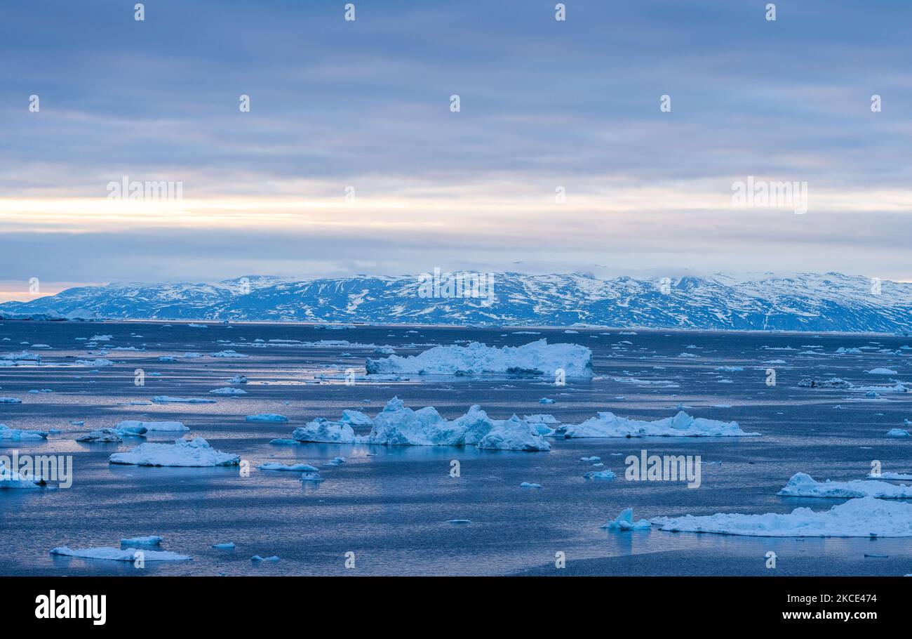 Icebergs near Ilulissat, Greenland. Climate change is having a profound ...