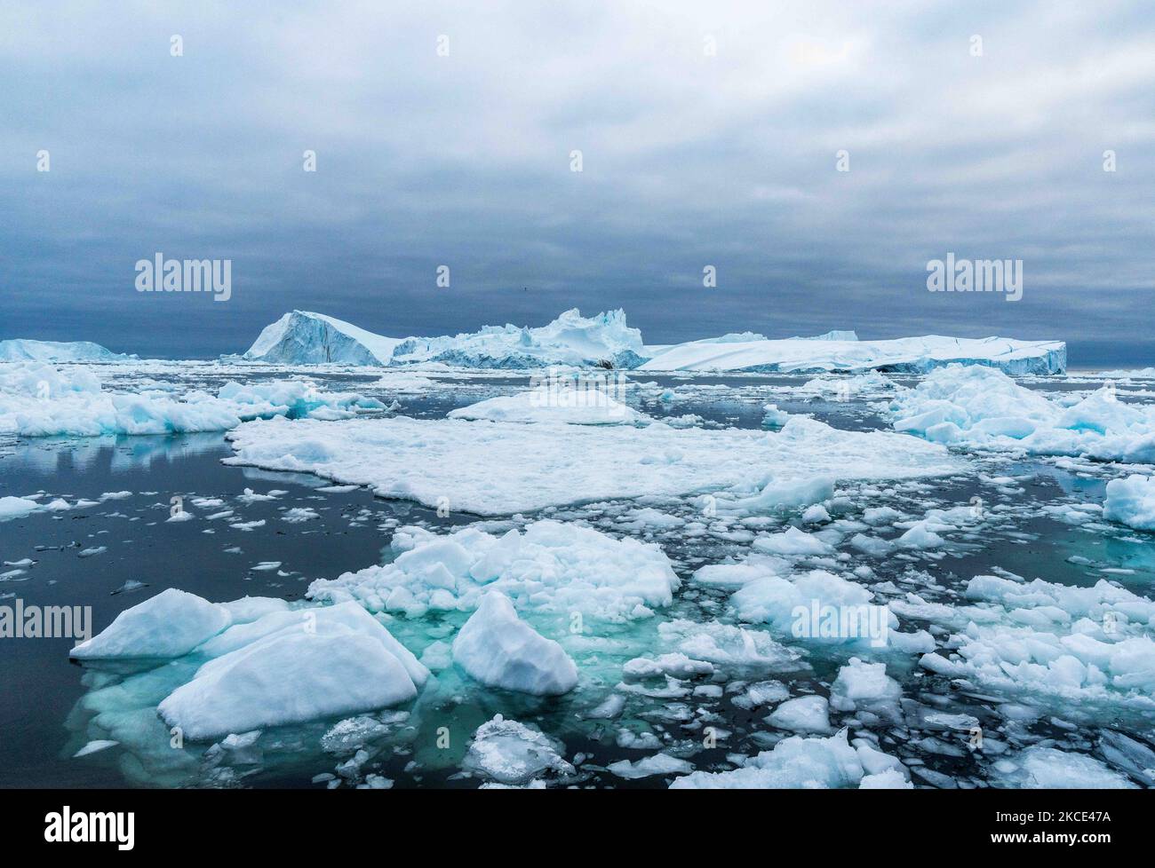 Icebergs near Ilulissat, Greenland. Climate change is having a profound ...