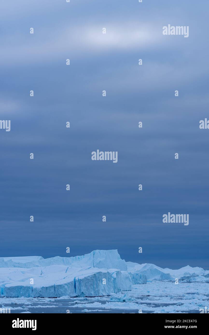 Icebergs near Ilulissat, Greenland. Climate change is having a profound ...