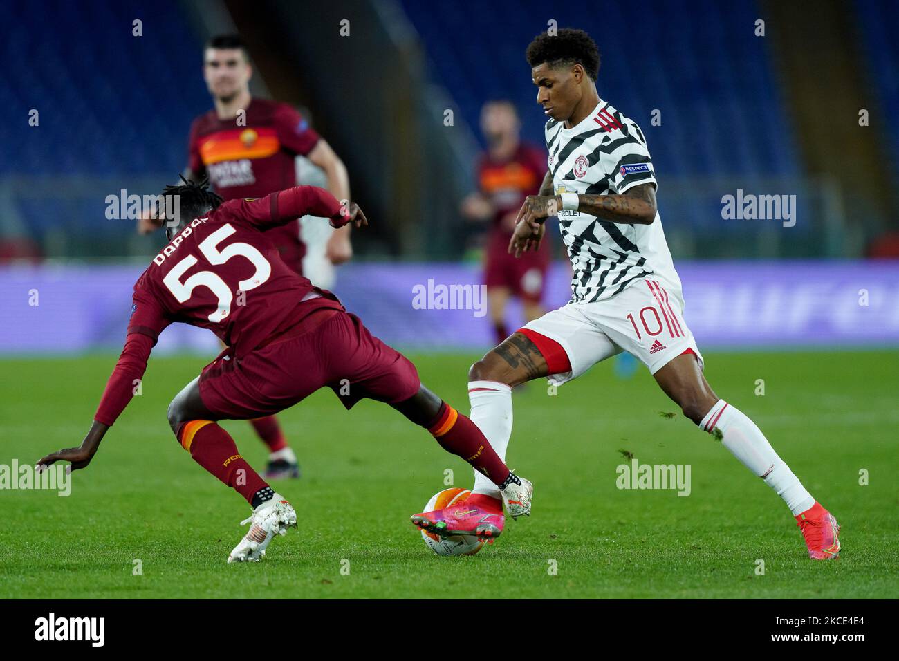 Marcus Rashford of Manchester United and Ebrima Darboe of AS Roma ...