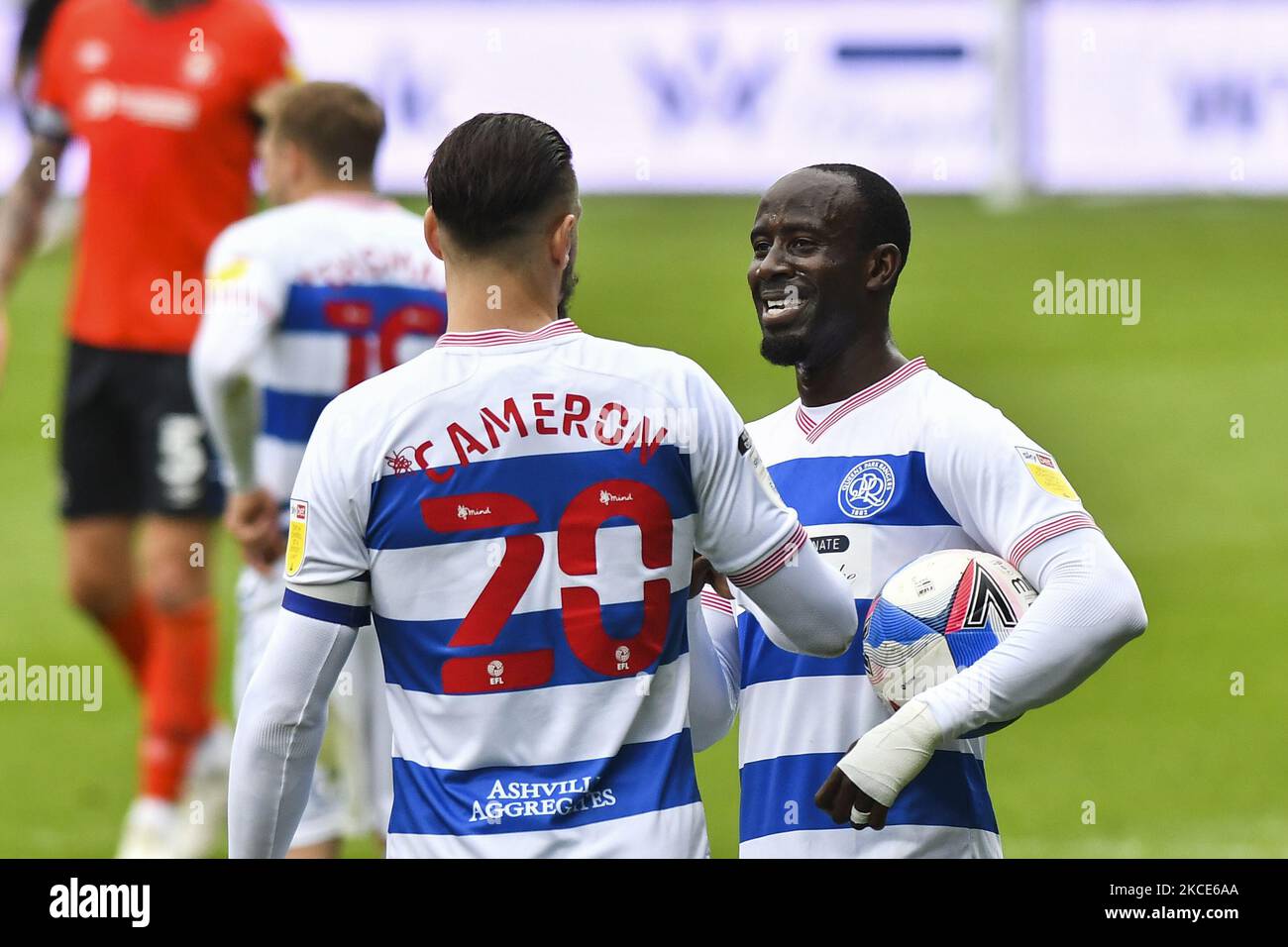 Geoff Cameron of QPR congratulate Albert Adomah of QPR after the Sky Bet Championship match between Queens Park Rangers and Luton Town at Loftus Road Stadium, London on Saturday 8th May 2021. (Photo by Ivan Yordanov/MI News/NurPhoto) Stock Photo