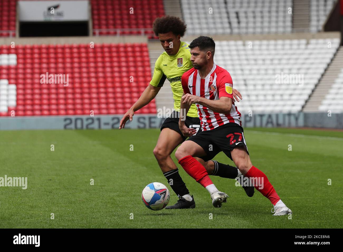 Jordan Jones of Sunderland in action with Northampton Town's Shaun McWilliams during the Sky Bet League 1 match between Sunderland and Northampton Town at the Stadium Of Light, Sunderland, UK on 9th May 2021. (Photo by Mark Fletcher/MI News/NurPhoto) Stock Photo