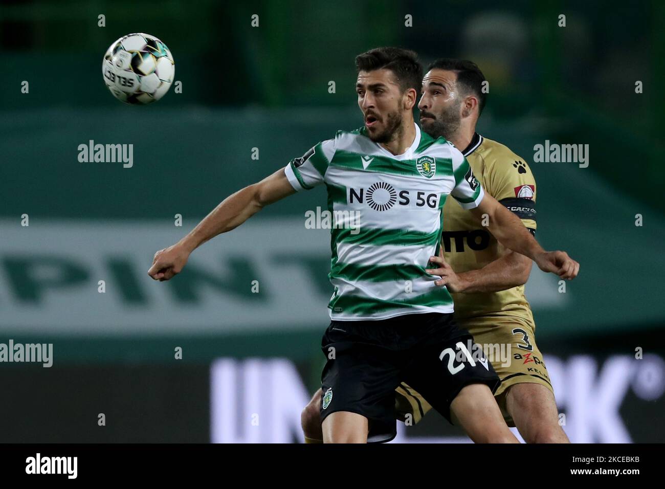 Paulinho of Sporting CP (L) vies with Adil Rami of Boavista FC during the Portuguese League football match between Sporting CP and Boavista FC at Jose Alvalade stadium in Lisbon, Portugal on May 11, 2021. (Photo by Pedro FiÃºza/NurPhoto) Stock Photo