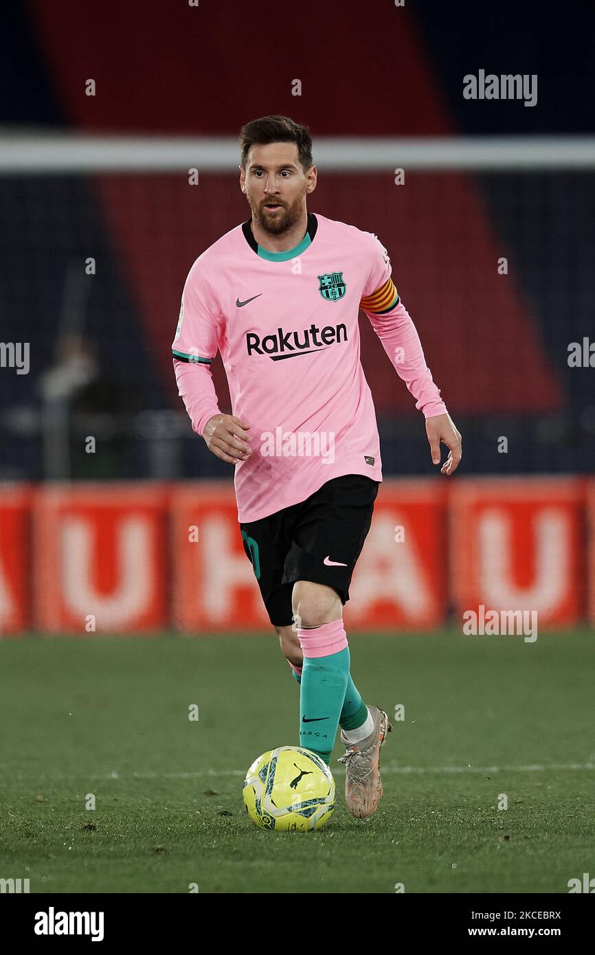Lionel messi barcelona controls ball hi-res stock