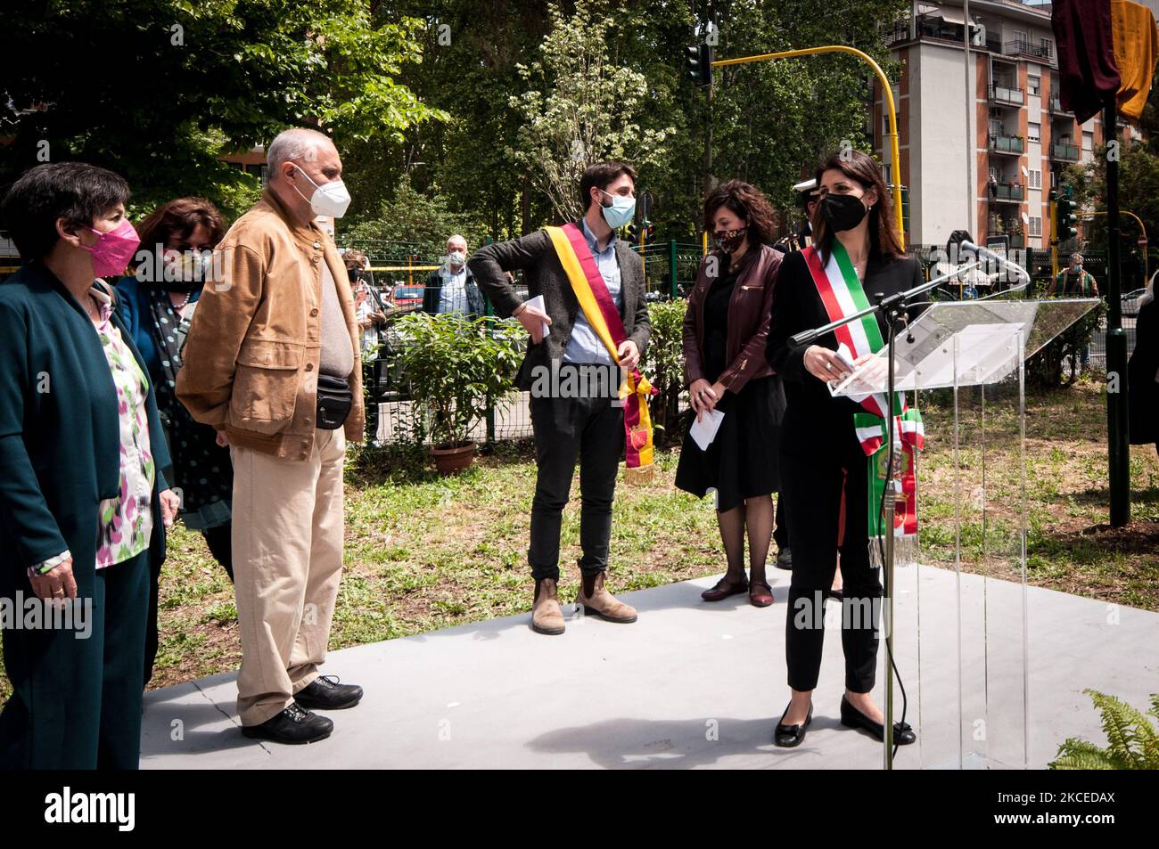 Rome's Mayor Virginia Raggi Virginia, Amedeo Ciaccheri and Roberto Colasanti during the ceremony of inauguration park in memory of Donatella Colasanti in her neighbourhood, San Paolo. Almost 46 years after the Circeo massacre, of which she was the only survivor and which marked her life forever, her brother Roberto unveiled the plaque - 'Donatella Colasanti, fighter for justice' - in the city park between Viale Giustiniano Imperatore and Via della Villa di Lucina. On May 12, 2021 in Rome, Italy (Photo by Andrea Ronchini/NurPhoto) Stock Photo