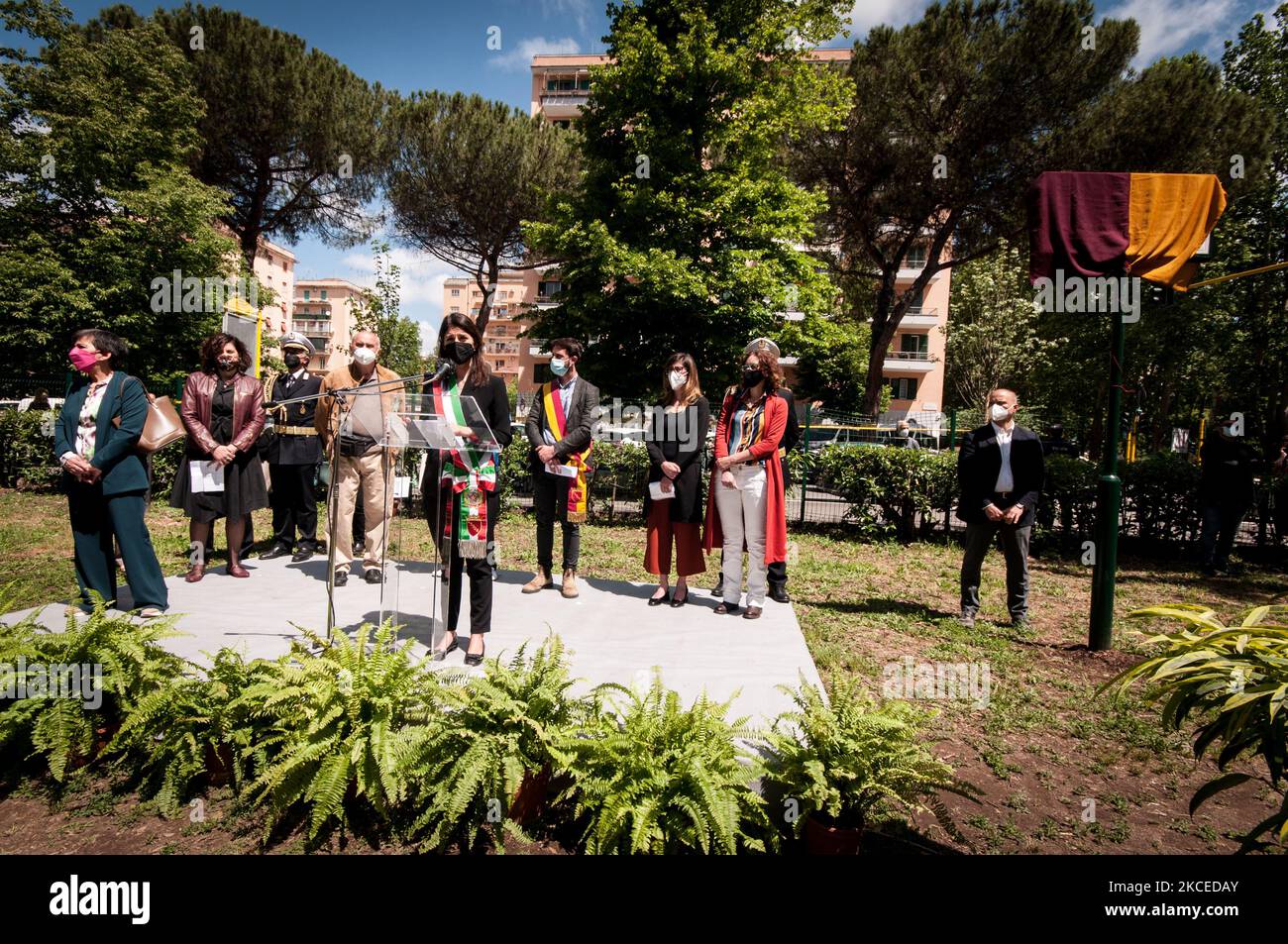 Rome's Mayor Virginia Raggi Virginia, Amedeo Ciaccheri and Roberto Colasanti during the ceremony of inauguration park in memory of Donatella Colasanti in her neighbourhood, San Paolo. Almost 46 years after the Circeo massacre, of which she was the only survivor and which marked her life forever, her brother Roberto unveiled the plaque - 'Donatella Colasanti, fighter for justice' - in the city park between Viale Giustiniano Imperatore and Via della Villa di Lucina. On May 12, 2021 in Rome, Italy (Photo by Andrea Ronchini/NurPhoto) Stock Photo