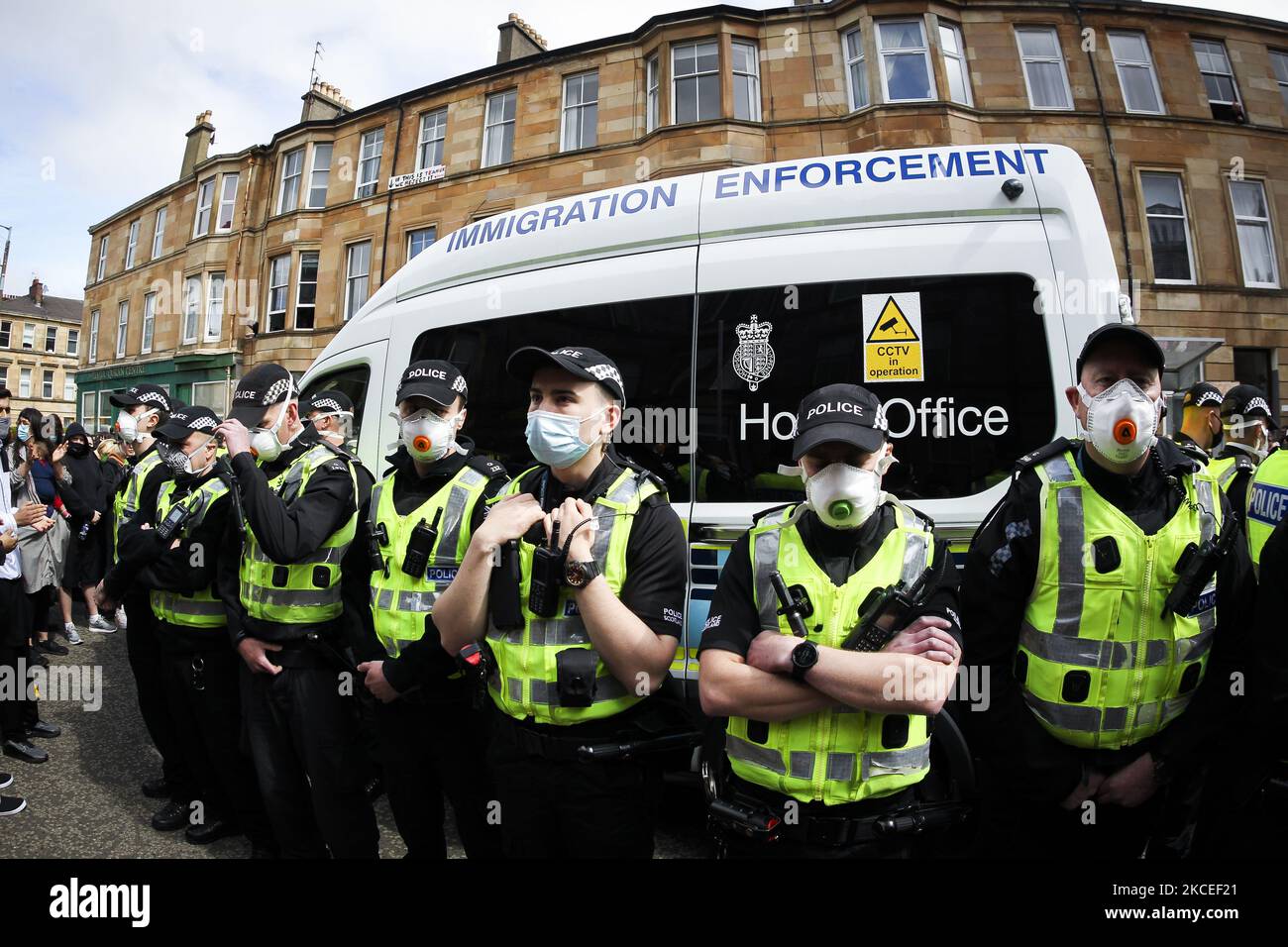 Protestors block an UK home office immigration enforcement van after an
