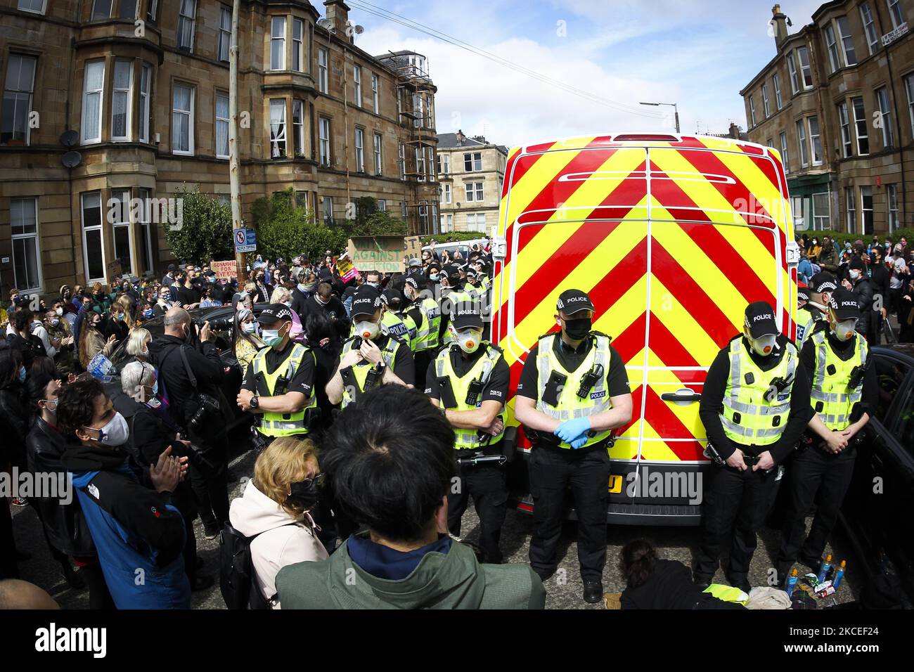 Protestors block an UK home office immigration enforcement van after an