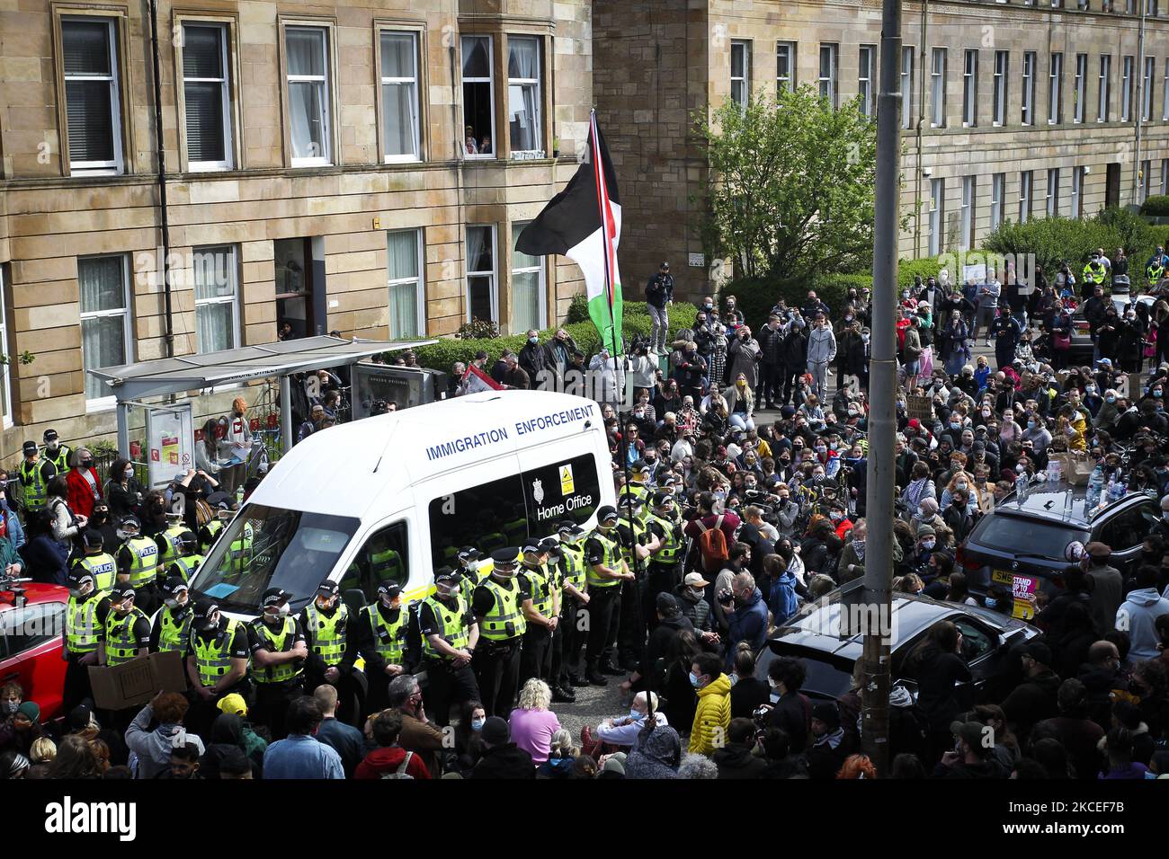 Protestors block an UK home office immigration enforcement van after an