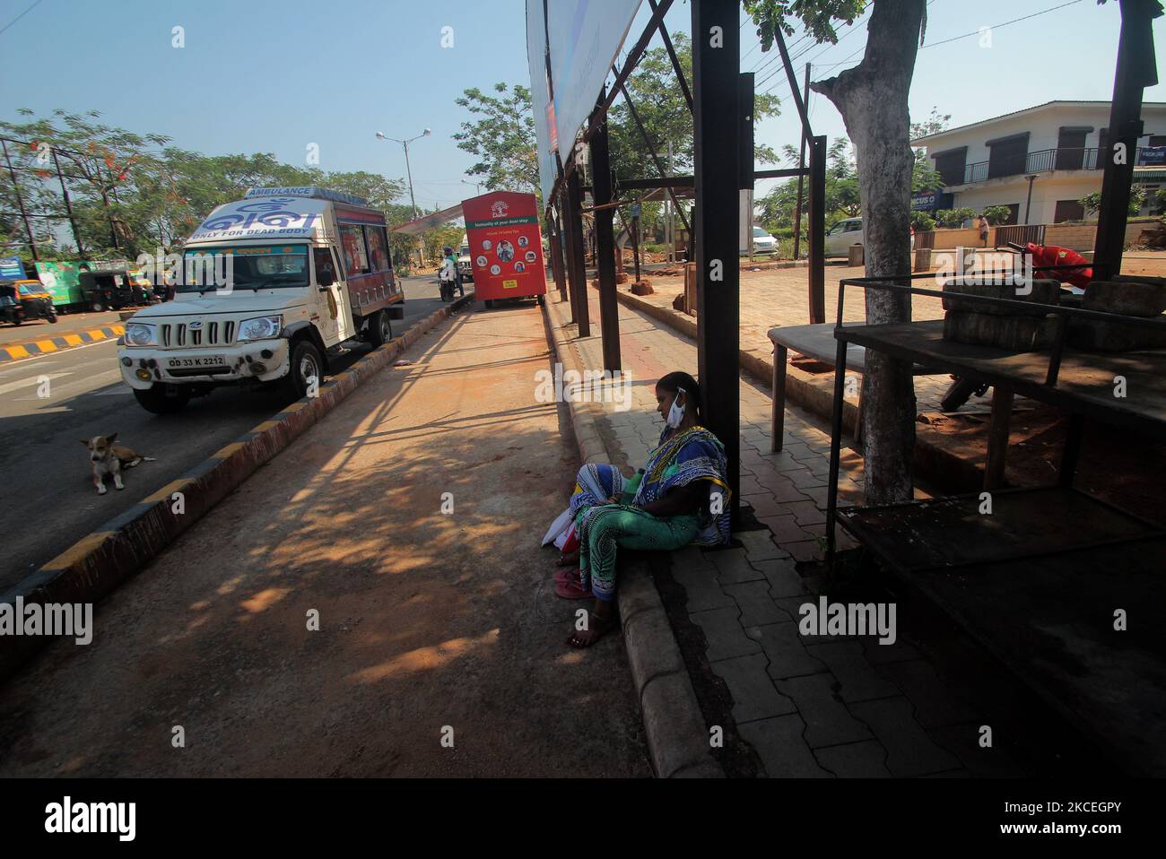 A relative of a patient naps on wayside just outskirts of the AIIMS hospital in between the lockdown period in the eastern Indian state Odisha's capital city Bhubaneswar. (Photo by STR/NurPhoto) Stock Photo