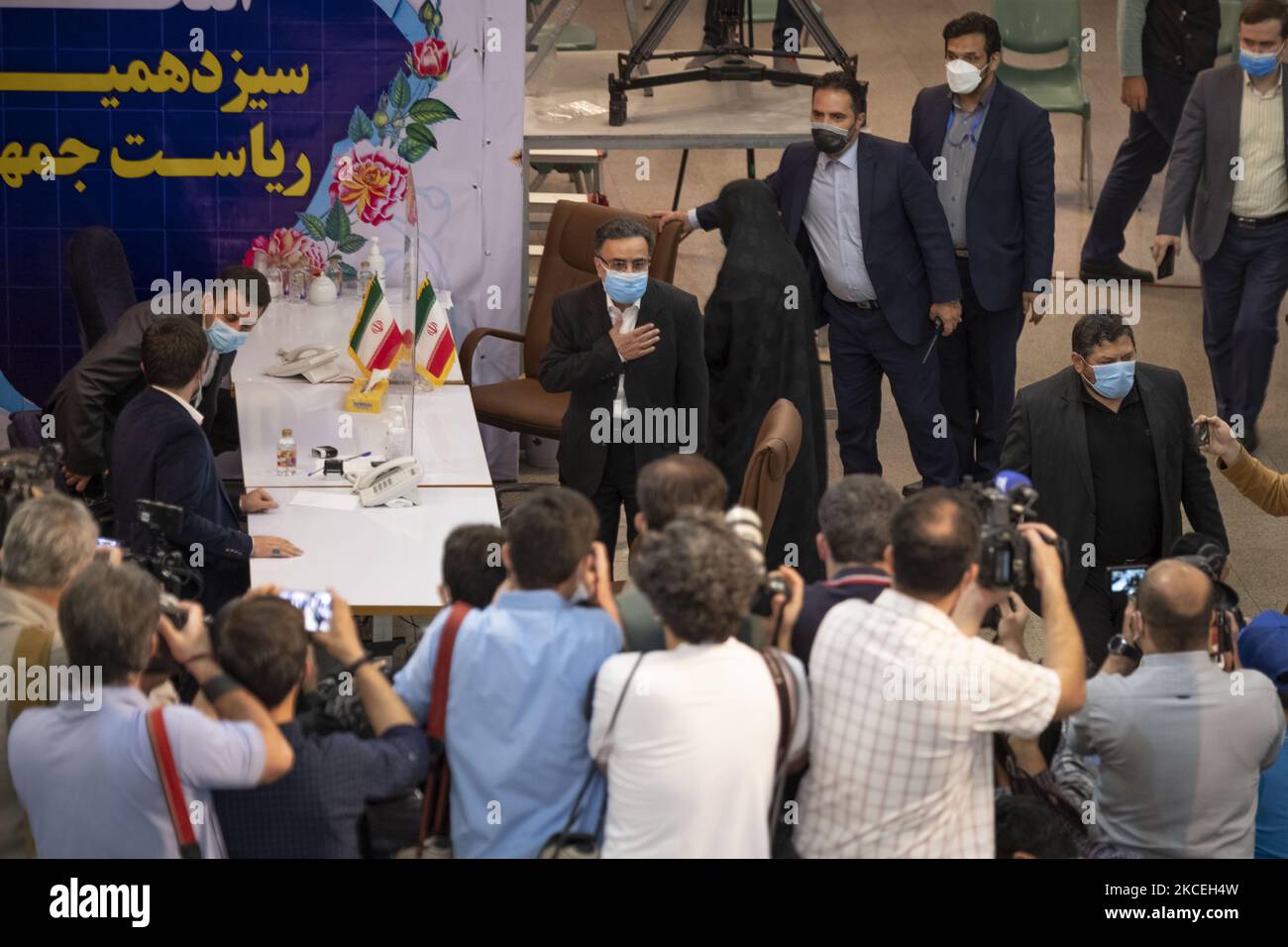 Mostafa Tajzadeh (C), Iranian reformist politician and a senior member of Islamic Iran Participation Front who was imprisoned at Evin Prison from 2009 until 2016, gestures while arriving the Interior Ministry building in central Tehran to register as Iran’s 2021 presidential elections candidate on May 14, 2021. (Photo by Morteza Nikoubazl/NurPhoto) Stock Photo