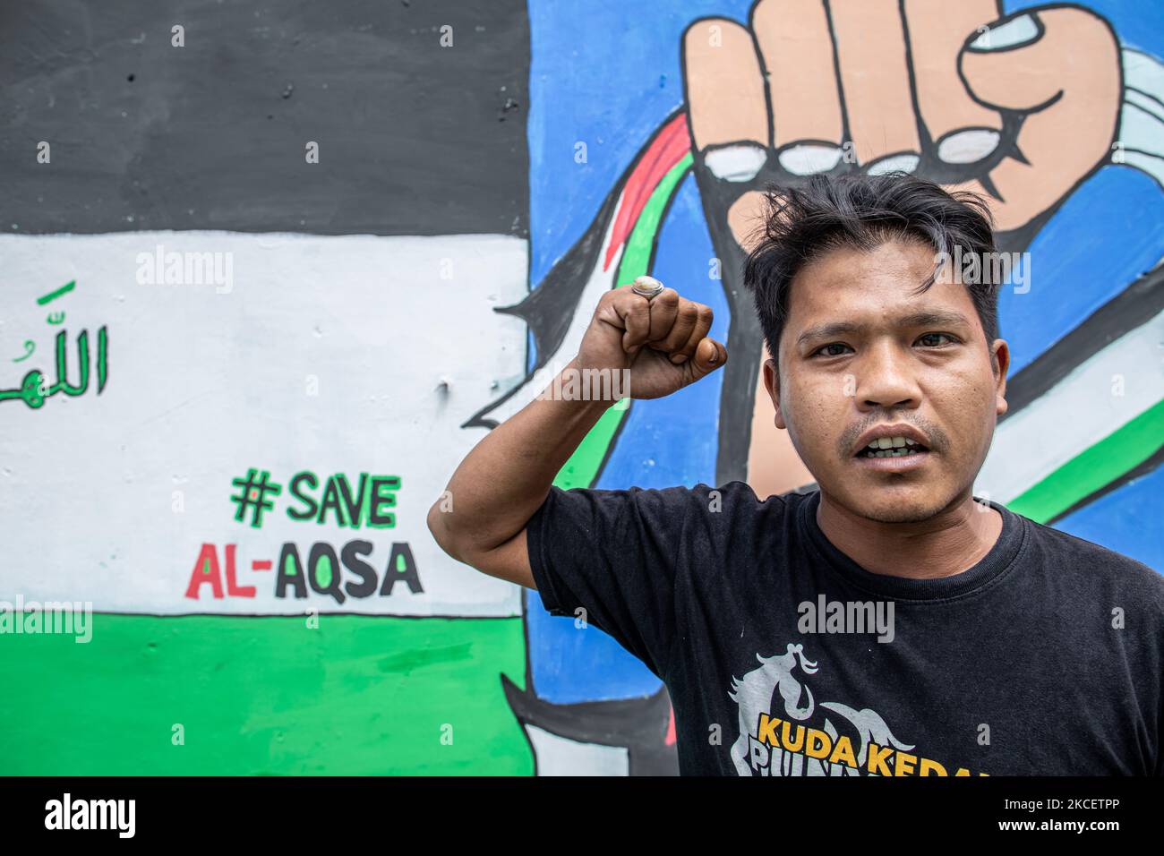 A Painting pro-Palestine is seen at a wall in Depok, West java, Indonesia on May 18, 2021. Thousands of Indonesian condemn the attack of Israel to Palestine Land. (Photo by Donal Husni/NurPhoto) Stock Photo