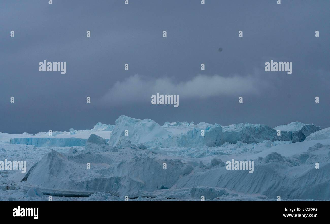 Icebergs near Ilulissat, Greenland. Climate change is having a profound ...