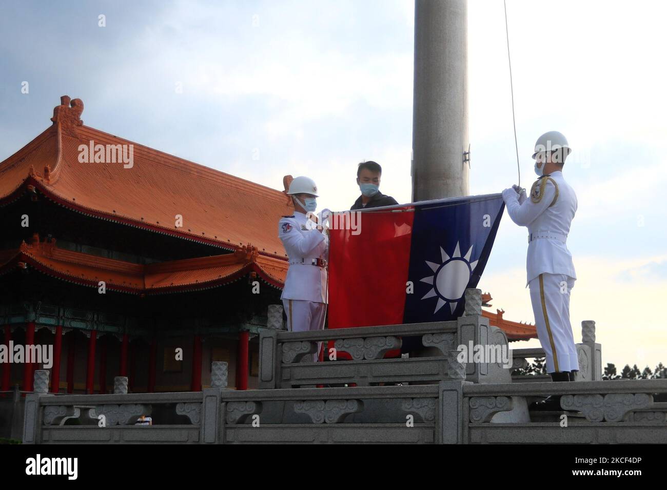 Taiwanese honor guards hold a Taiwan flag at Liberty Square, amid a ...