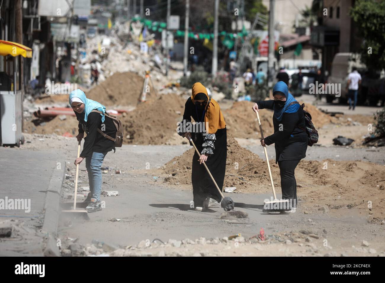 Gaza Clean Palestinian volunteers sweep the floor during a campaign to clean up ...
