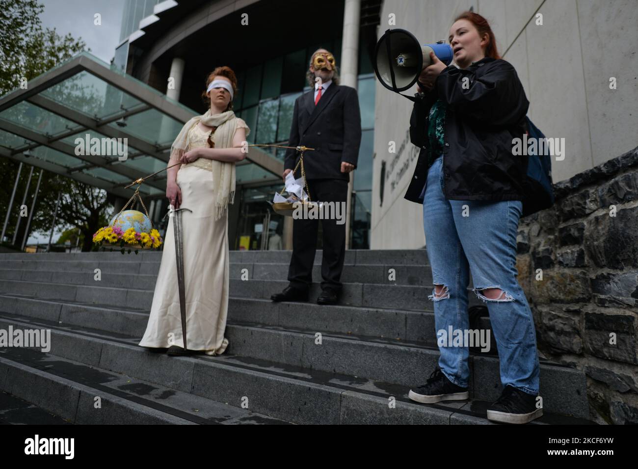 Orla Murphy, addresses the media outside the Criminal Court of Justice in Dublin. Extinction Rebellion activists staged a theatrical protest on the steps of the Criminal Court of Justice in Dublin to show the injustice of climate inaction as 20-year-old Orla Murphy, a climate activist, appears in court for criminal damages. On Tuesday, May 25, 2021, in Dublin, Ireland. (Photo by Artur Widak/NurPhoto) Stock Photo