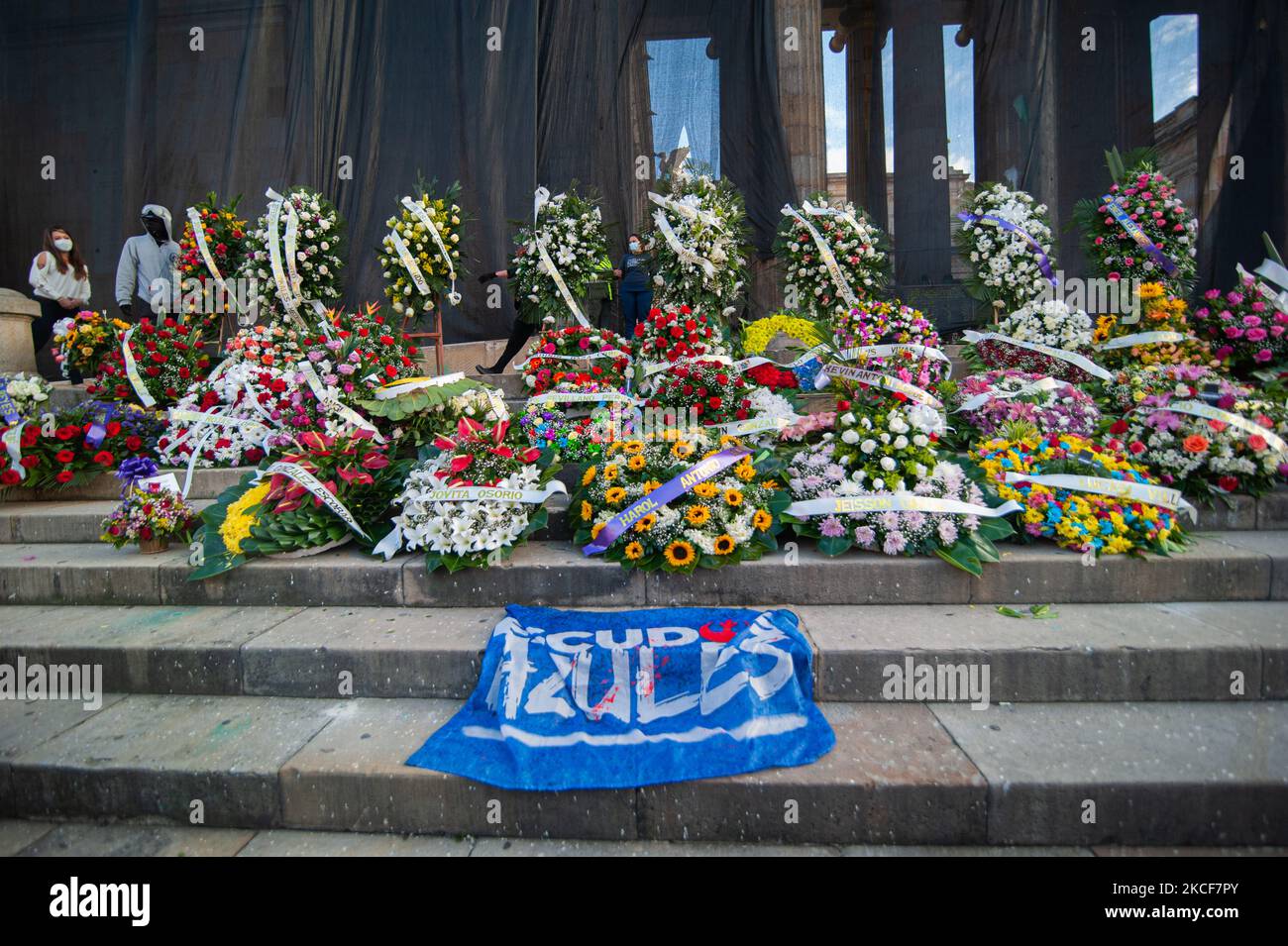 Several funeral wreaths to honor the demonstrators dead in police abuse of authority cases during the protests as people gather at Plaza de Bolivar in front of the Congress Capitol to support the motion censure to Colombia's Defense Minister Diego Molano after at least 45 deaths in police brutality cases during the ongoing anti-government protests against tax and health reforms and police brutality evolved in Colombia for the last weeks, in Bogota, Colombia on May 24, 2021. (Photo by Sebastian Barros/NurPhoto) Stock Photo