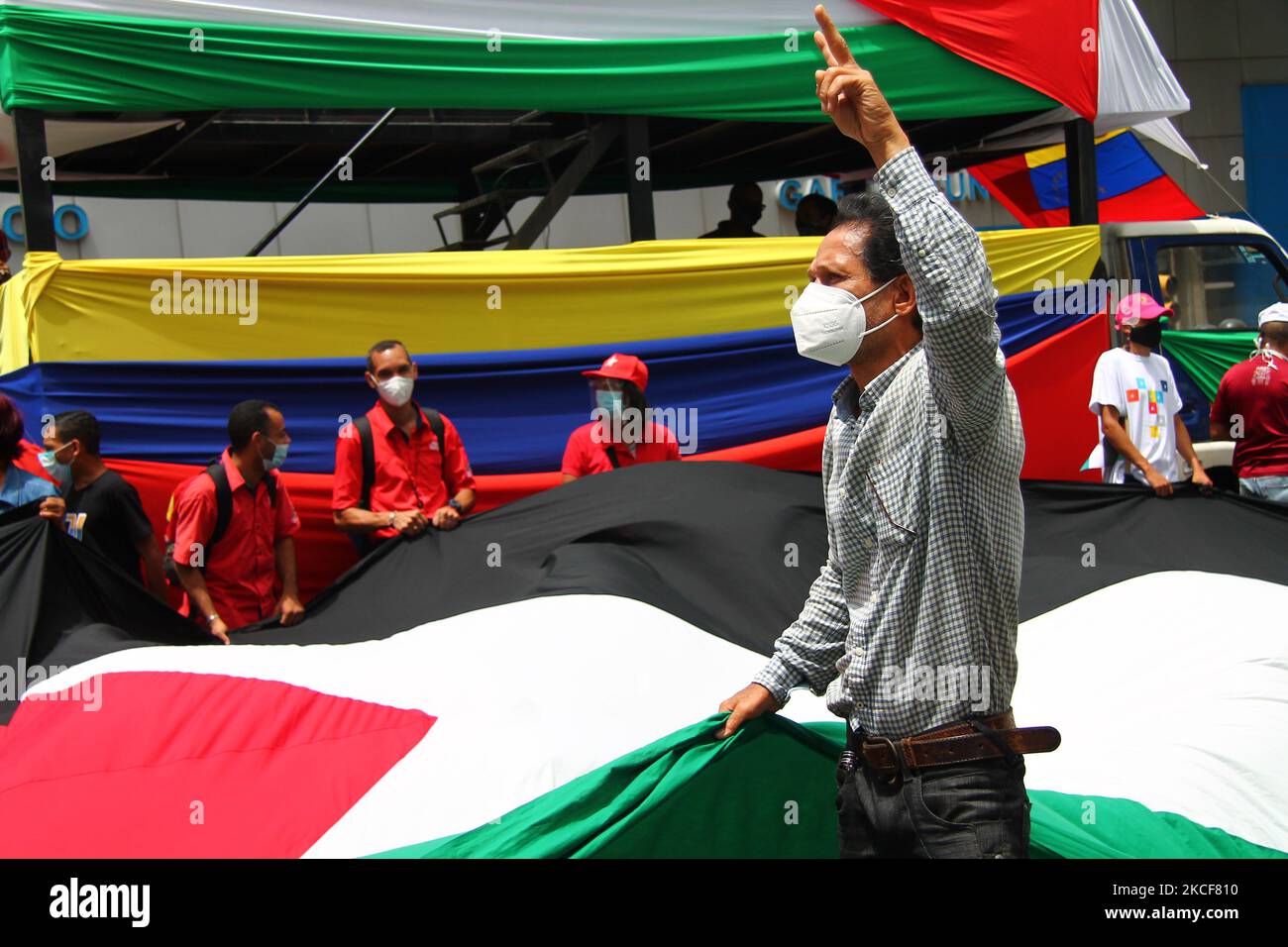 A man gestures during a march in solidarity with the Palestinian people over the armed conflict with the state of Israel, amid the Covid-19 pandemic, in Caracas, Venezuela on May 25, 2021. (Photo by Javier Campos/NurPhoto) Stock Photo