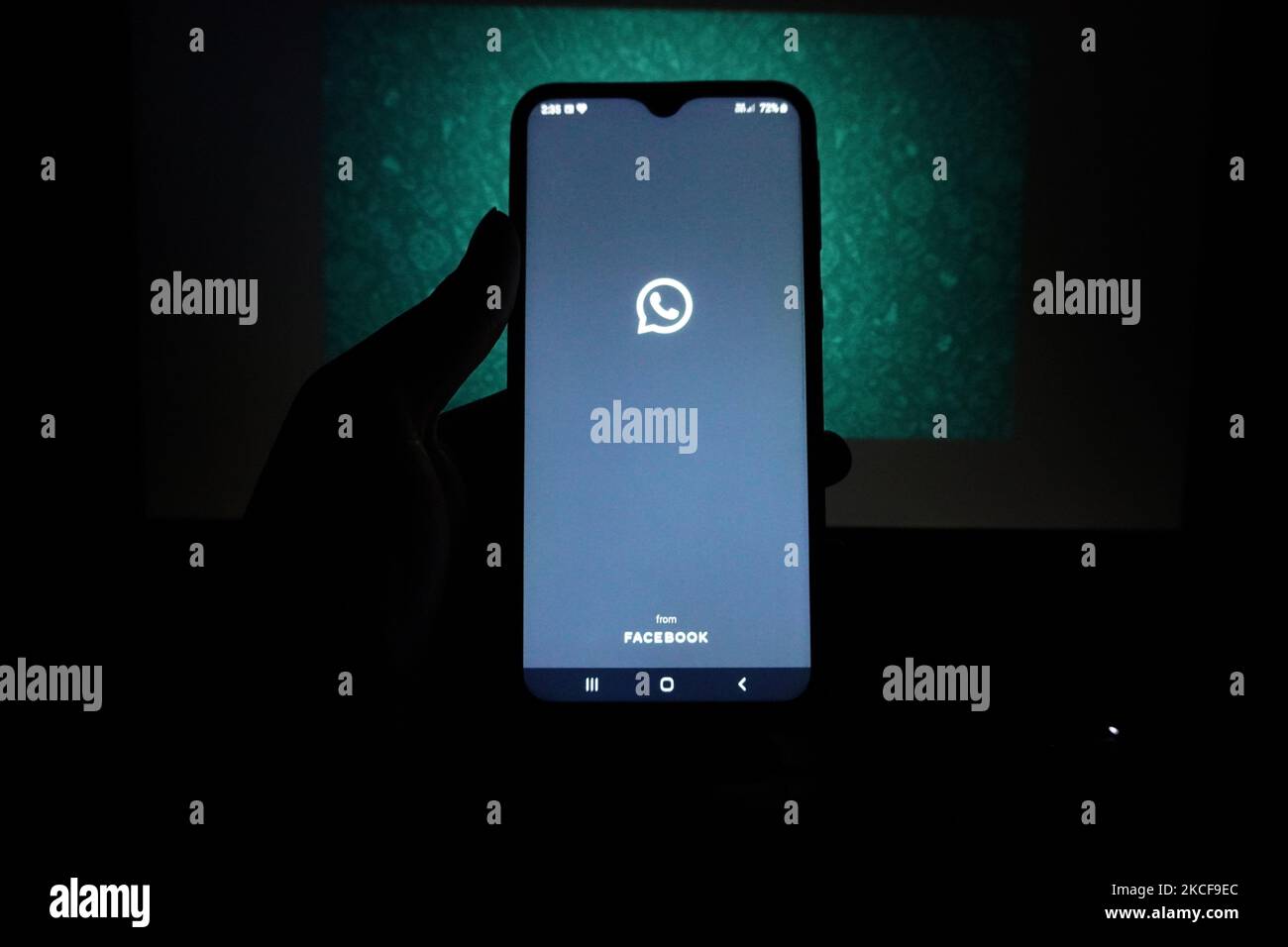 The logo of the messenger app WhatsApp is seen on the screen of a smartphone in New Delhi, India on May 27, 2021. WhatsApp has filed a legal complaint in Delhi against the government seeking to block regulations coming into force from Wednesday that experts say would compel the California-based Facebook unit to break privacy protections, according to Reuters sources. (Photo by Mayank Makhija/NurPhoto) Stock Photo