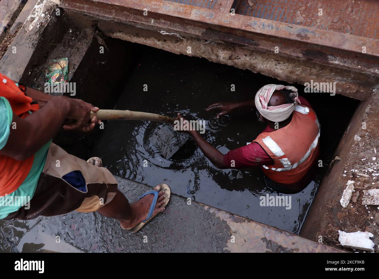 Municipality workers cleaning drains of Guwahati city ahead of flood