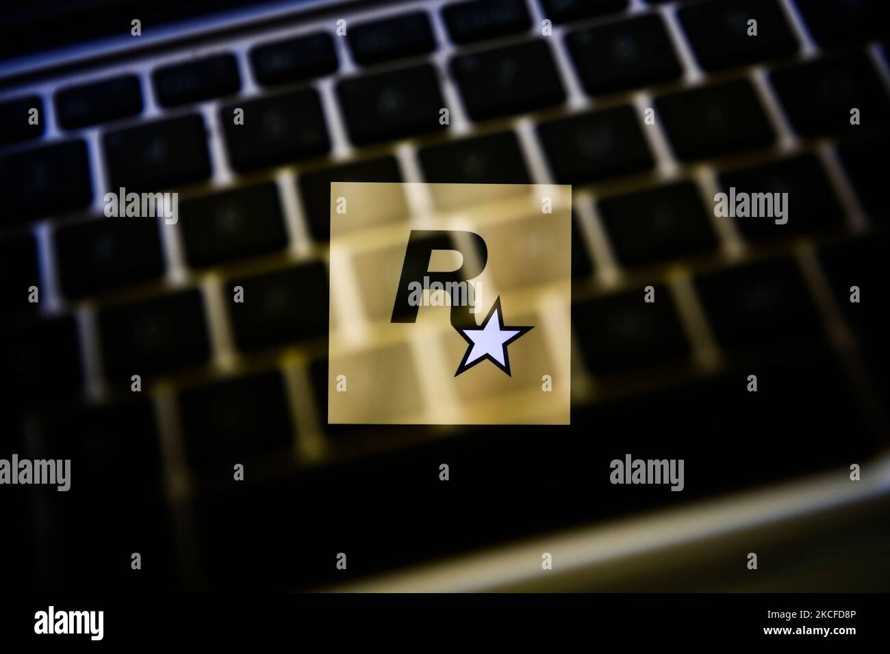 In this photo illustration a Rockstar Games logo seen displayed on a  smartphone with video games cover in the background. (Photo by Thiago  Prudencio / SOPA Images/Sipa USA Stock Photo - Alamy