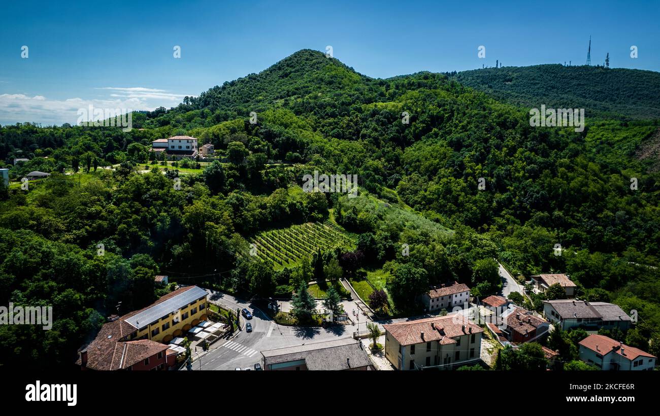 A drone view of the Euganean Hills, near Teolo, Italy, on May 30, 2021. The Euganean Hills are a group of hills of volcanic origin that rise to heights of 300 to 600 m from the Padovan-Venetian plain a few km south of Padua. (Photo by STR/NurPhoto) Stock Photo
