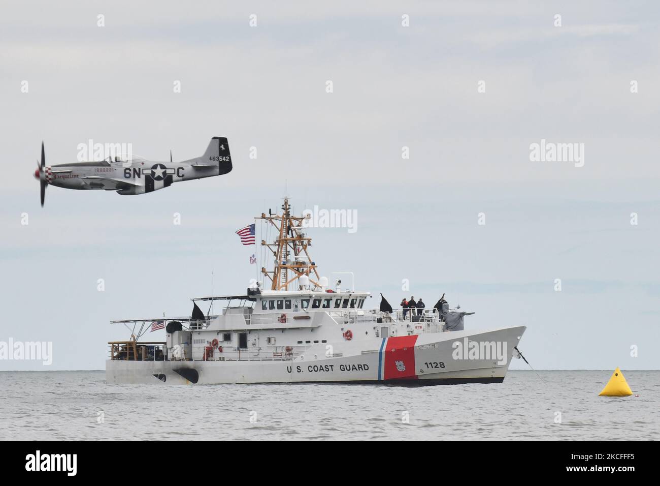 After the entire weekend of shows were canceled due to heavy storms, an improvised Memorial Day airshow was held at New York's Jones Beach, featuring World War 2 aircraft from the American Airpower Museum and the U.S. Air Force Thunderbirds. Here, a World War 2-era P-51 aircraft flies over the Coast Guard cutter Bruckenthal on 31 May 2021 in New York, US. (Photo by B.A. Van Sise/NurPhoto) Stock Photo