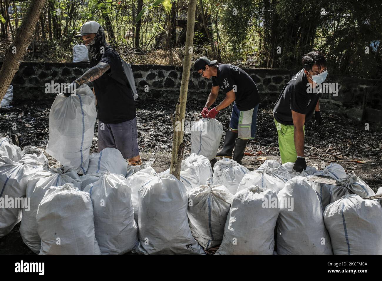 Volunteers of Sungai Watch take part in cleaning river canal from ...