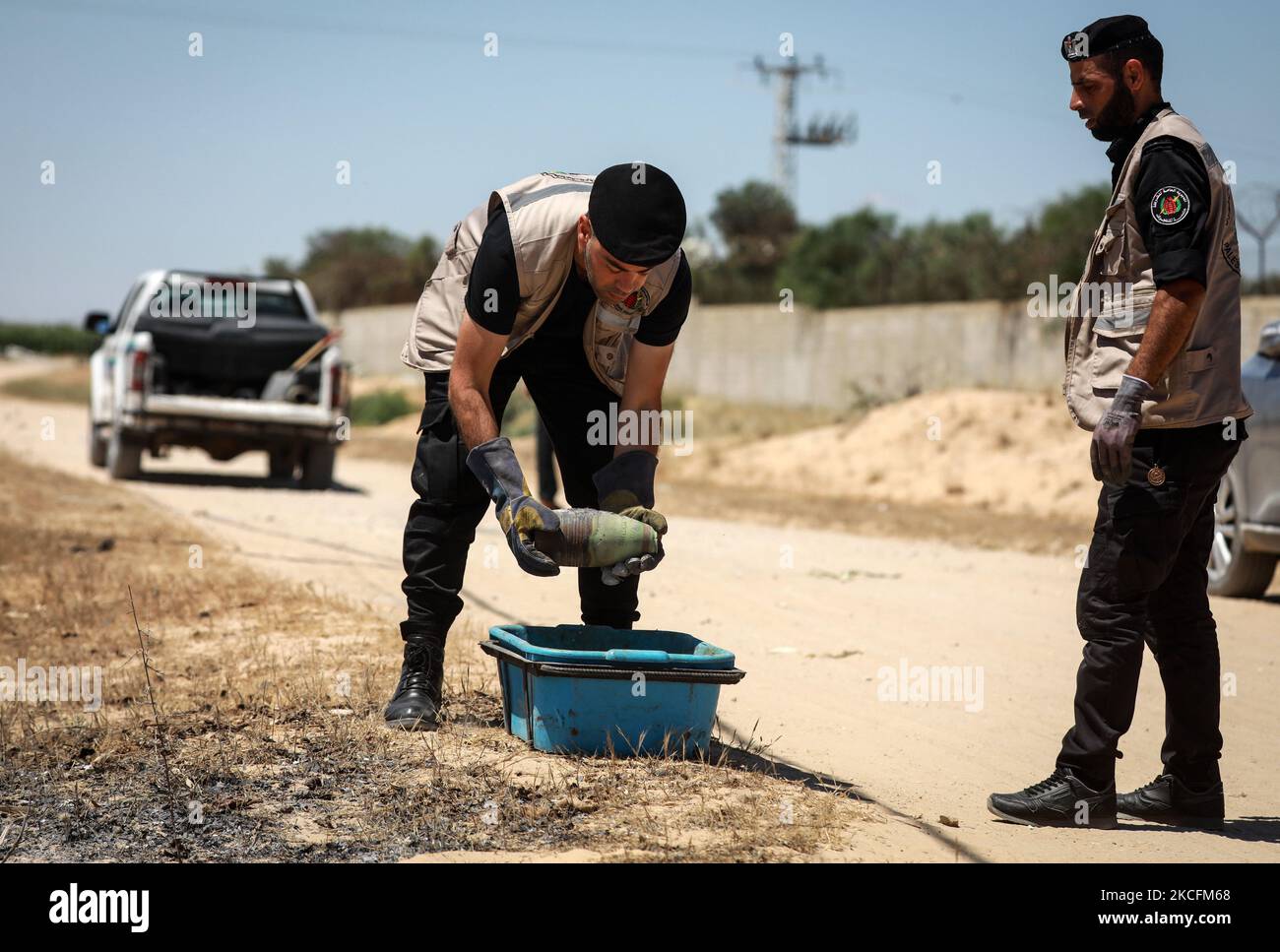 Explosives experts of Hamas stow away in the back of a vehicle a collected unexploded projectile from the aftermath of the May 2021 conflict with Israel, in Khan Yunis in the southern Gaza Strip on June 5, 2021. (Photo by Majdi Fathi/NurPhoto) Stock Photo