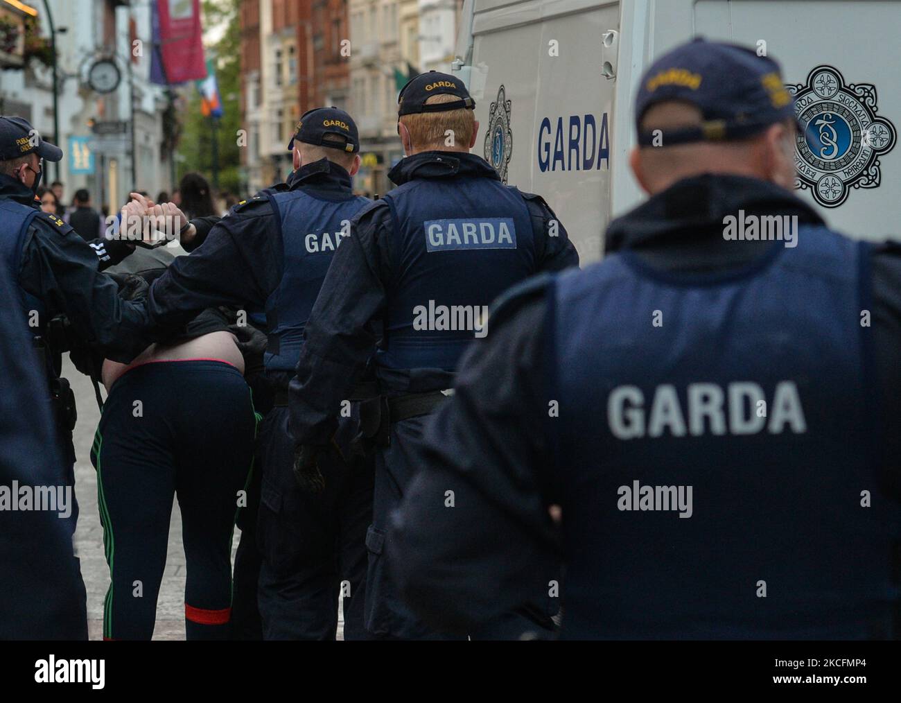 Members of Gardai Public Order Unit arresting a man as they enforce