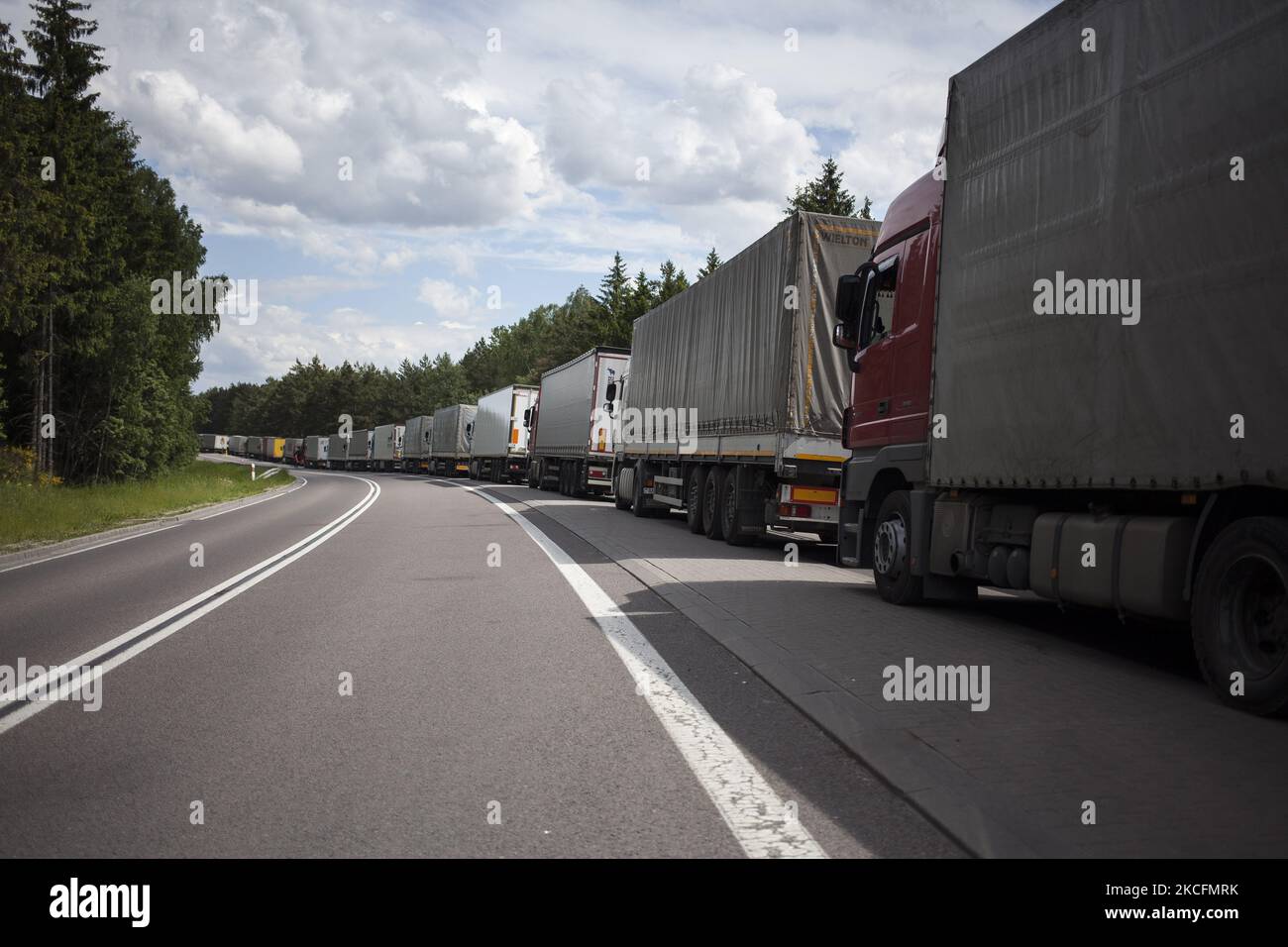 TIR trucks waits on EU border crossing in Bobrowniki on June 6, 2021. (Photo by Maciej Luczniewski/NurPhoto) Stock Photo