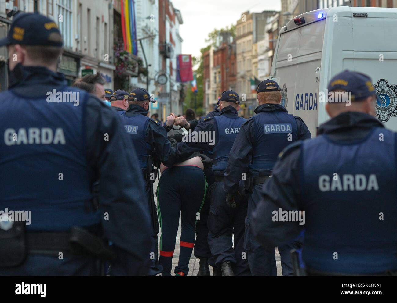 Members of Gardai arrest a young man on Grafton Street in Dublin, on Saturday evening, June 5, 2021. Nineteen people were arrested on suspicion of violating public order after another night of rioting in downtown Dublin. Glass bottles and other missiles were thrown at the gardai after they collided with large crowds in the city on Saturday night. On Sunday, 6 June 2021, in Dublin, Ireland. (Photo by Artur Widak/NurPhoto) Stock Photo
