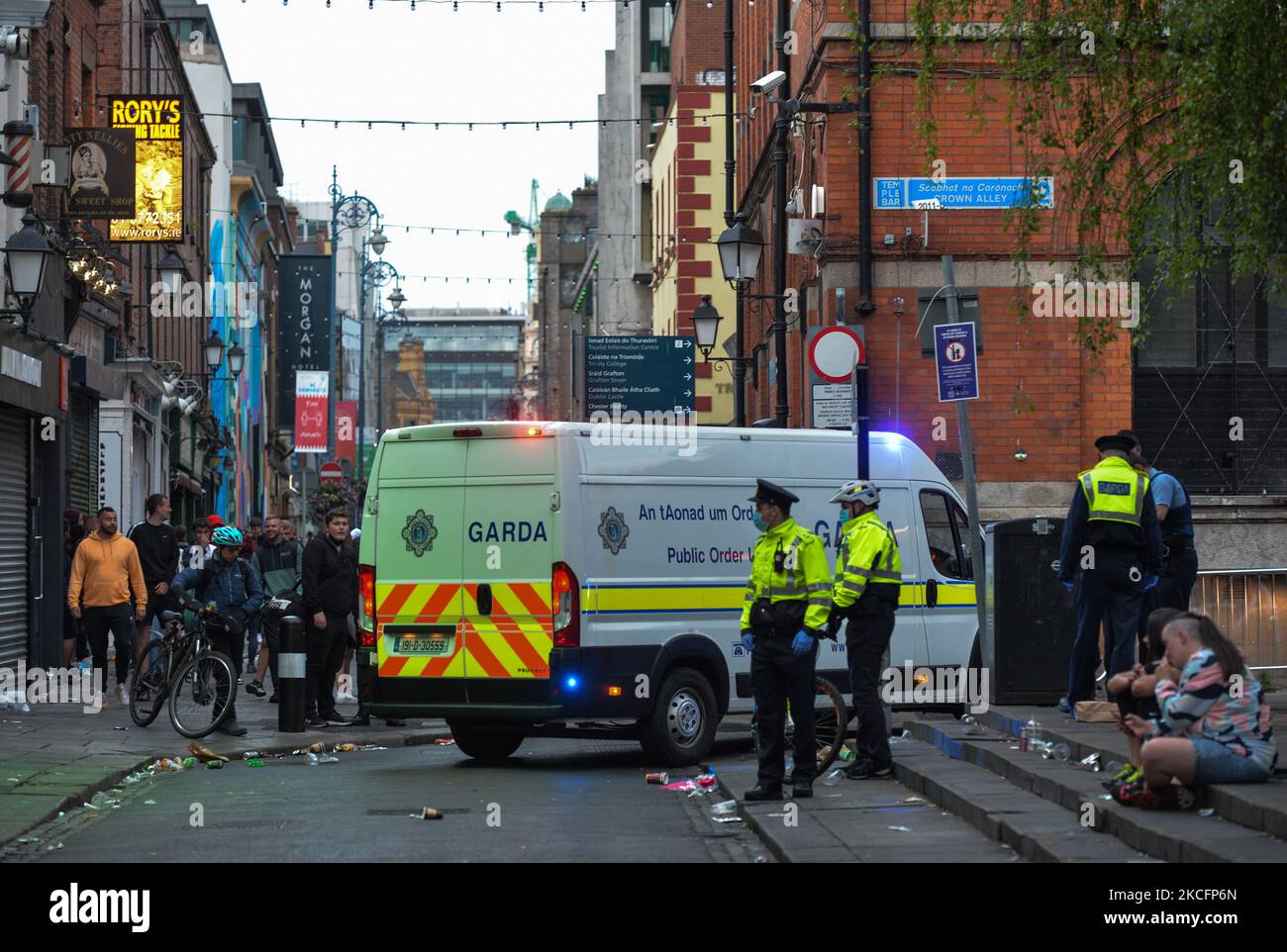 Members of Gardai enforcing coronavirus restrictions and relocating people from Temple Bar in Dublin. On Sunday, 6 June 2021, in Dublin, Ireland. (Photo by Artur Widak/NurPhoto) Stock Photo