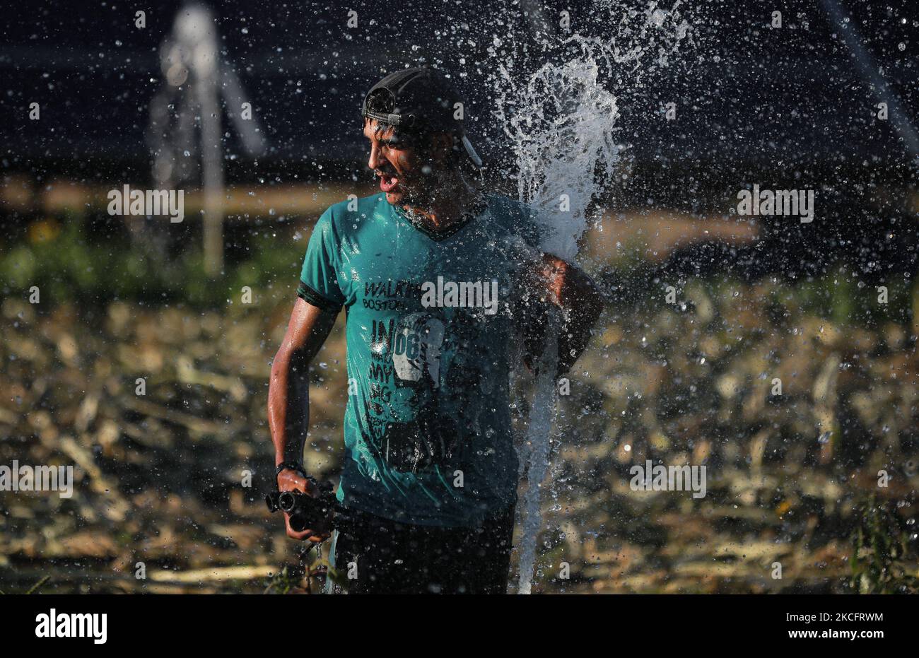 A Palestinian man wash his face, in Beit Hanun in the northern Gaza ...