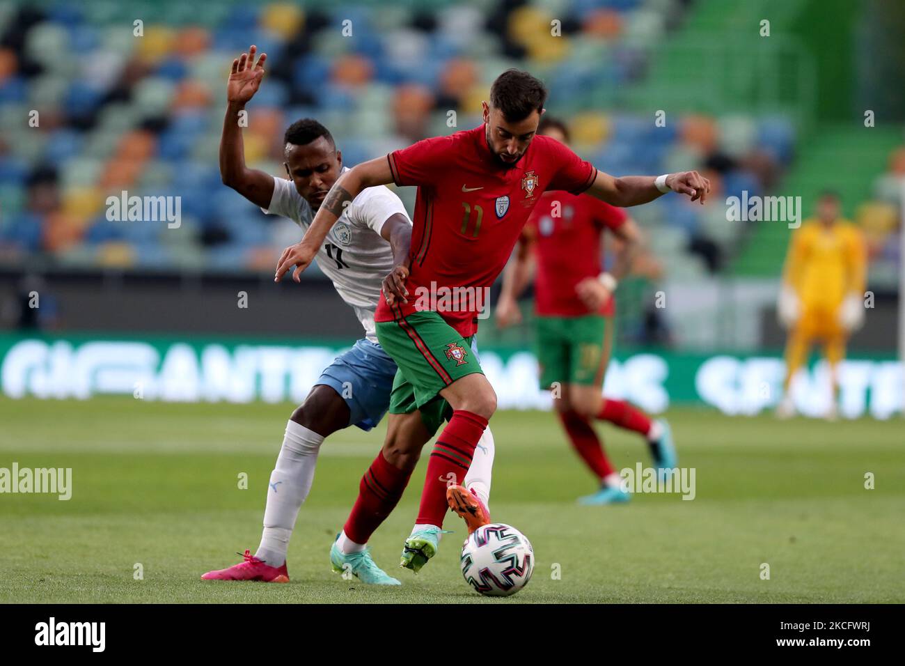 Bruno Fernandes of Portugal (R ) vies with Gadi Kinda of Israel during the international friendly football match between Portugal and Israel, at the Jose Alvalade stadium in Lisbon, Portugal, on June 9, 2021, ahead of the UEFA EURO 2020 European Championship. (Photo by Pedro FiÃºza/NurPhoto) Stock Photo