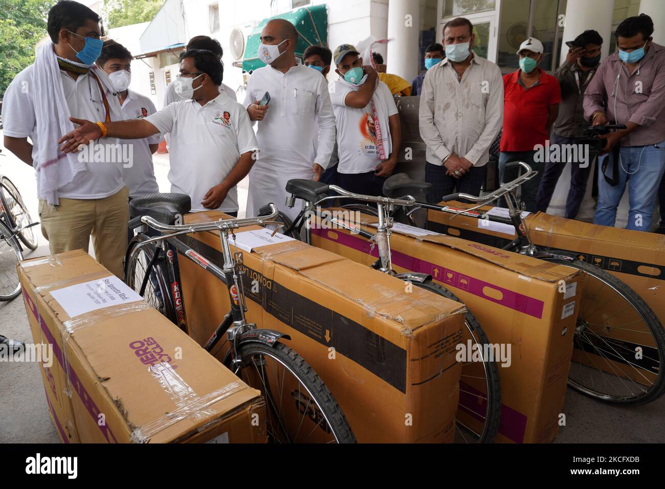 Indian Youth Congress (IYC) members stand next to bicycles packed to be sent to different ministers in the Indian government as a sign of protest against the rising fuel prices, in New Delhi, India on June 10, 2021. (Photo by Mayank Makhija/NurPhoto) Stock Photo
