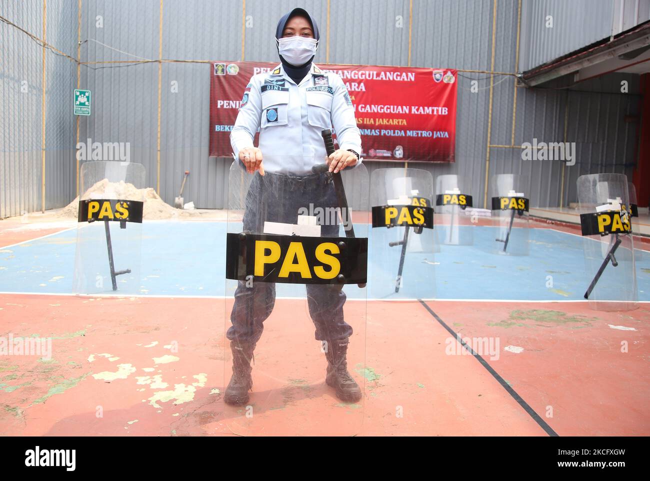 A number of female prison guards conduct training on simulation and riot control in class IIA women's prison (Penitentiary) Pondok Bambu, East Jakarta, Indonesia, on June 10, 2021. The exercise is in the context of increasing vigilance and security in prisons when controlling riots or riots that occur, because the lives of inmates are very vulnerable to commotion in prisons. (Photo by Dasril Roszandi/NurPhoto) Stock Photo