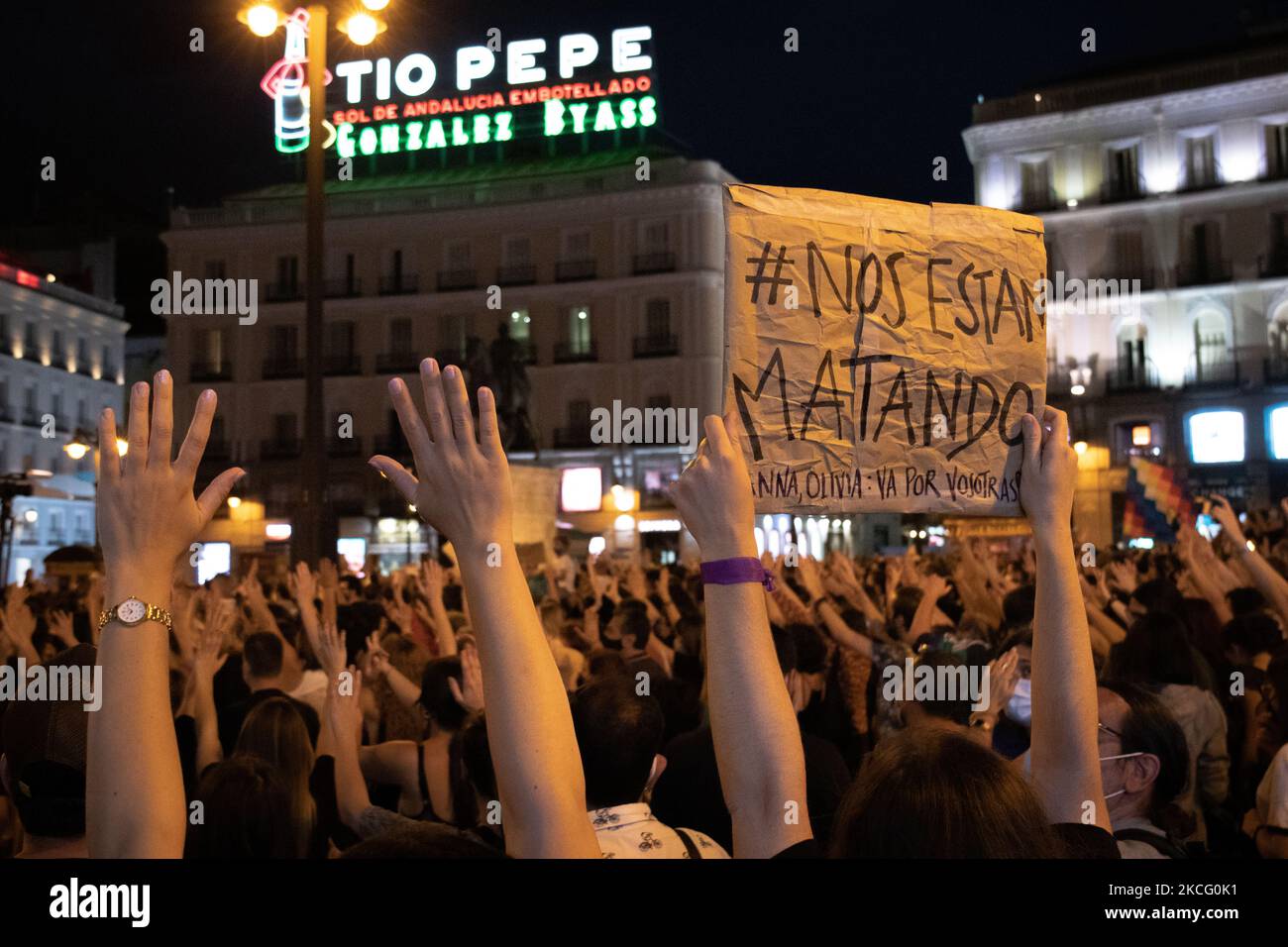 Feminist rally in repudiation of feminicides at Puerta del Sol in Madrid, Spain, on June 11, 2021, under the slogans: ''Ni una menos'' (Not one less); ''Si nos tocan a una nos tocan a todas'' (If they touch one of us, they touch us all) and ''Vivas nos queremos'' (Alive we love each other). A candlelight vigil was held in remembrance of the women and children murdered victims of gender violence (Photo by Alvaro Laguna/NurPhoto) Stock Photo