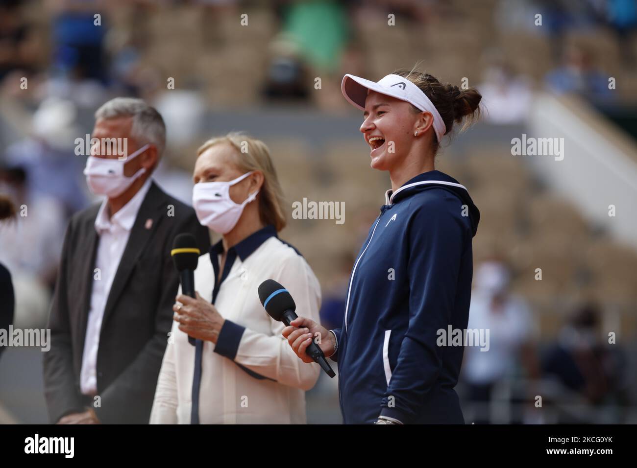 President of the French Tennis Federation (FFT) and former player Gilles Moretton (L) and former tennis player Martina Navratilova (R) congratulate Czech Republic's Barbora Krejcikova (C) as she receives the Suzanne Lenglen Cup after winning the women's singles final tennis match against Russia's Anastasia Pavlyuchenkova during the trophy ceremony on Day 14 of The Roland Garros 2021 French Open tennis tournament in Paris on June 12, 2021. (Photo by Mehdi Taamallah / Nurphoto) (Photo by Mehdi Taamallah/NurPhoto) Stock Photo