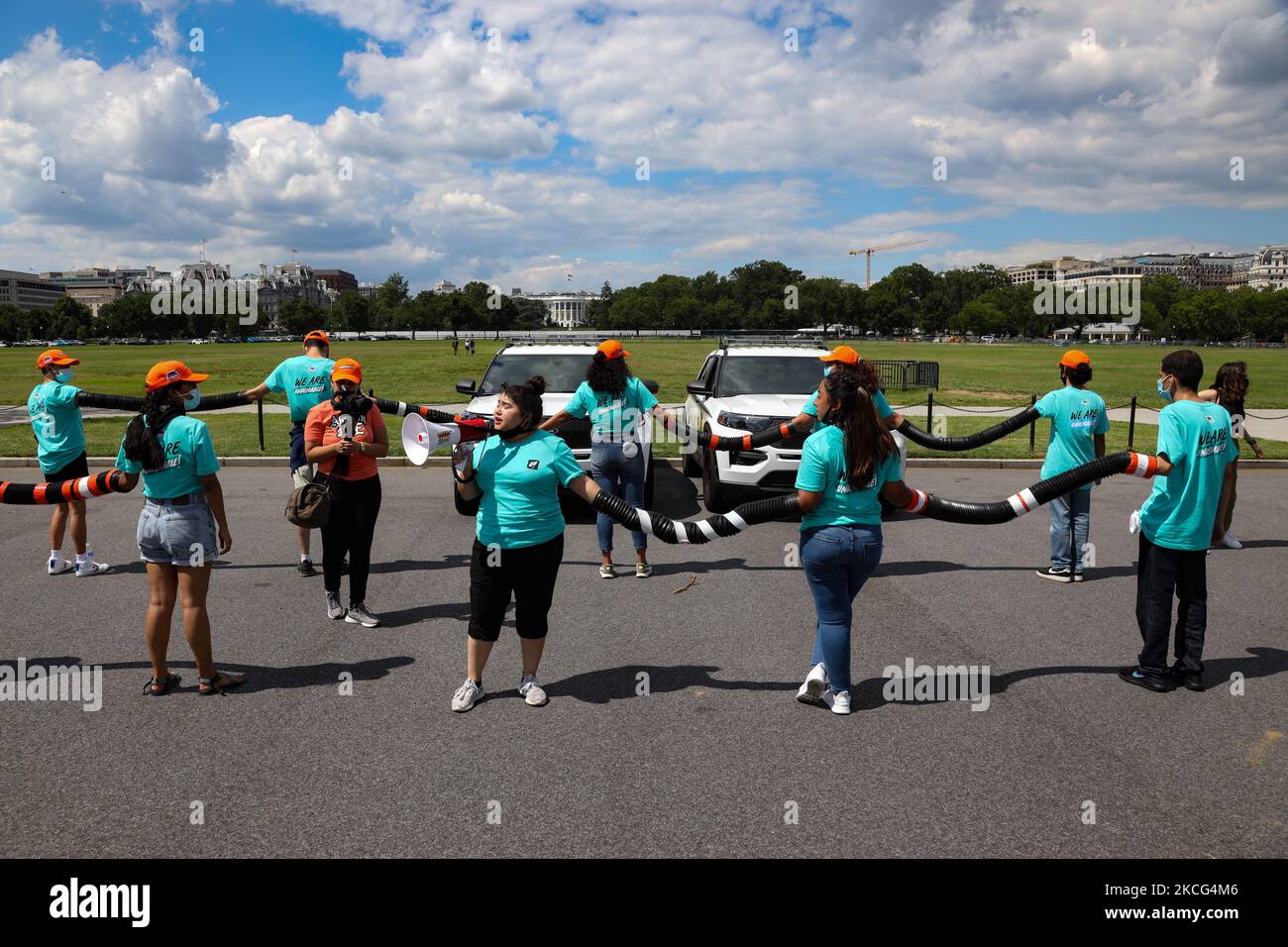 Demonstrators lock arms during a direct action at a Secret Service vehicle checkpoint entrance to the White House grounds on June 15, 2021. Activists associated with the United We Dream organization gathered on the 9th anniversary of the Obama administration signing the Deferred Action for Childhood Arrivals policy to demand continued immigration protections and reform (Photo by Bryan Olin Dozier/NurPhoto) Stock Photo