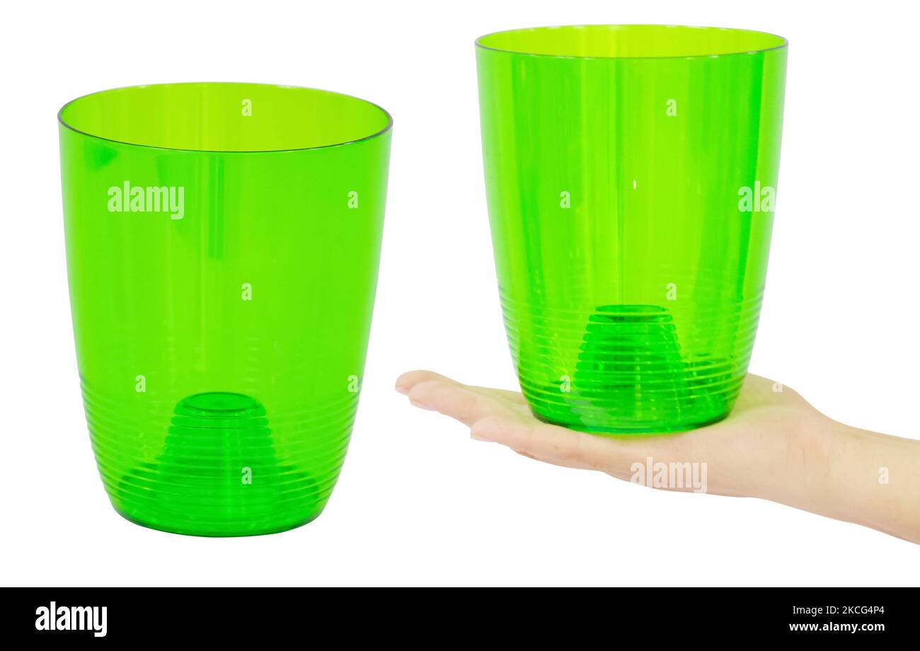 Green empty flower pot made of plastic. Isolated from the background Stock Photo