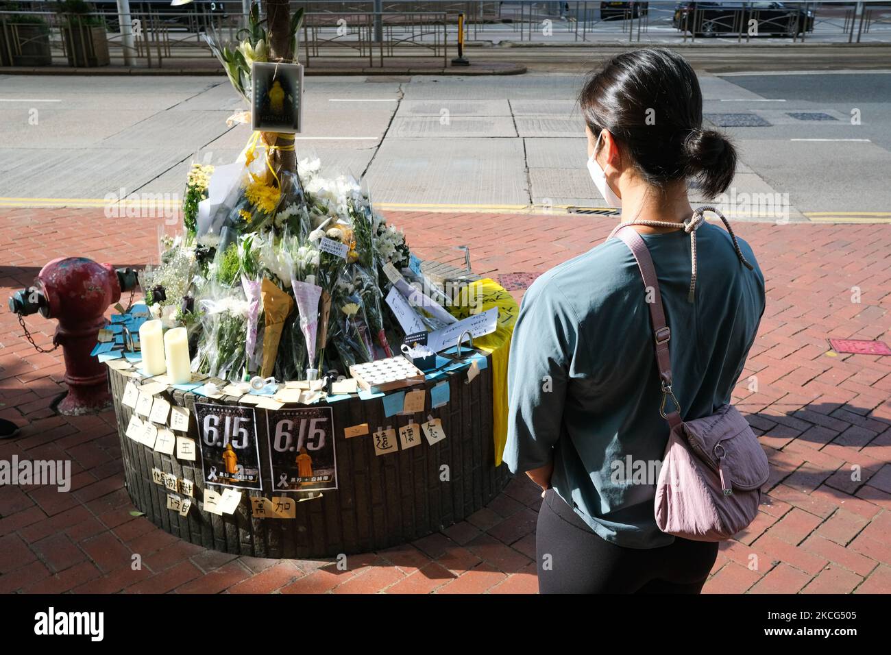 Someone came to mourn spontaneously, in Hong Kong, China, on June 15, 2021. June 15, 2021, is the second anniversary of the death of Hong Kong's first Anti-ELAB Movement protester. Many citizens came to mourn and offer flowers spontaneously. Police officers were also present at the scene to control the flow of people on the grounds of epidemic prevention. (Photo by Leung Man Hei/NurPhoto) Stock Photo