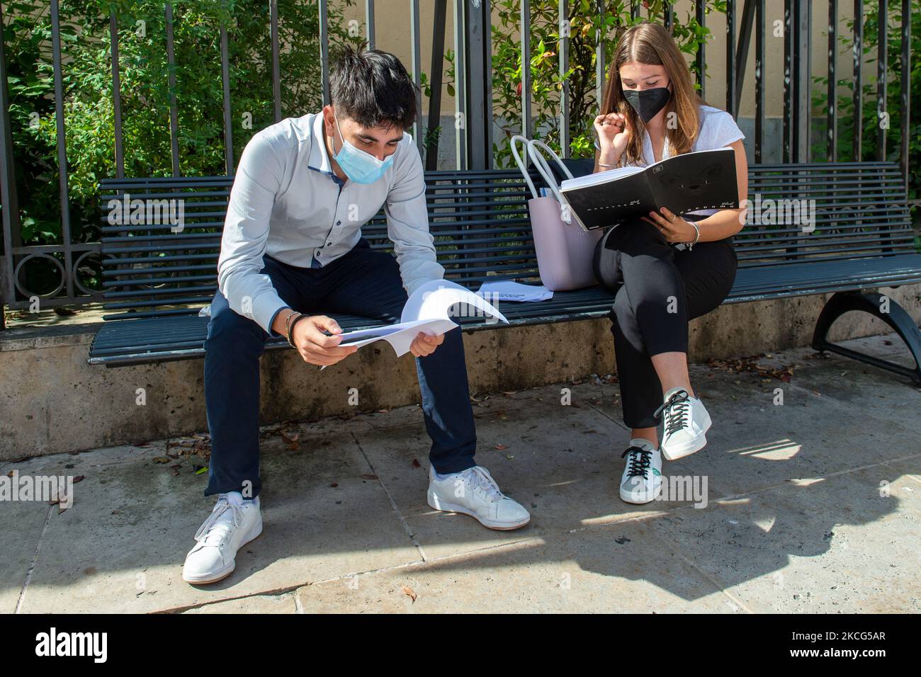 Students last quick review before going in for the oral interview their exam subjects while waiting for their turn outside the high school in Rieti, Italy, on June 16, 2021. High-school graduation exams commence today in Italy with distancing rules a cause of the COVID-19 pandemic. (Photo by Riccardo Fabi/NurPhoto) Stock Photo