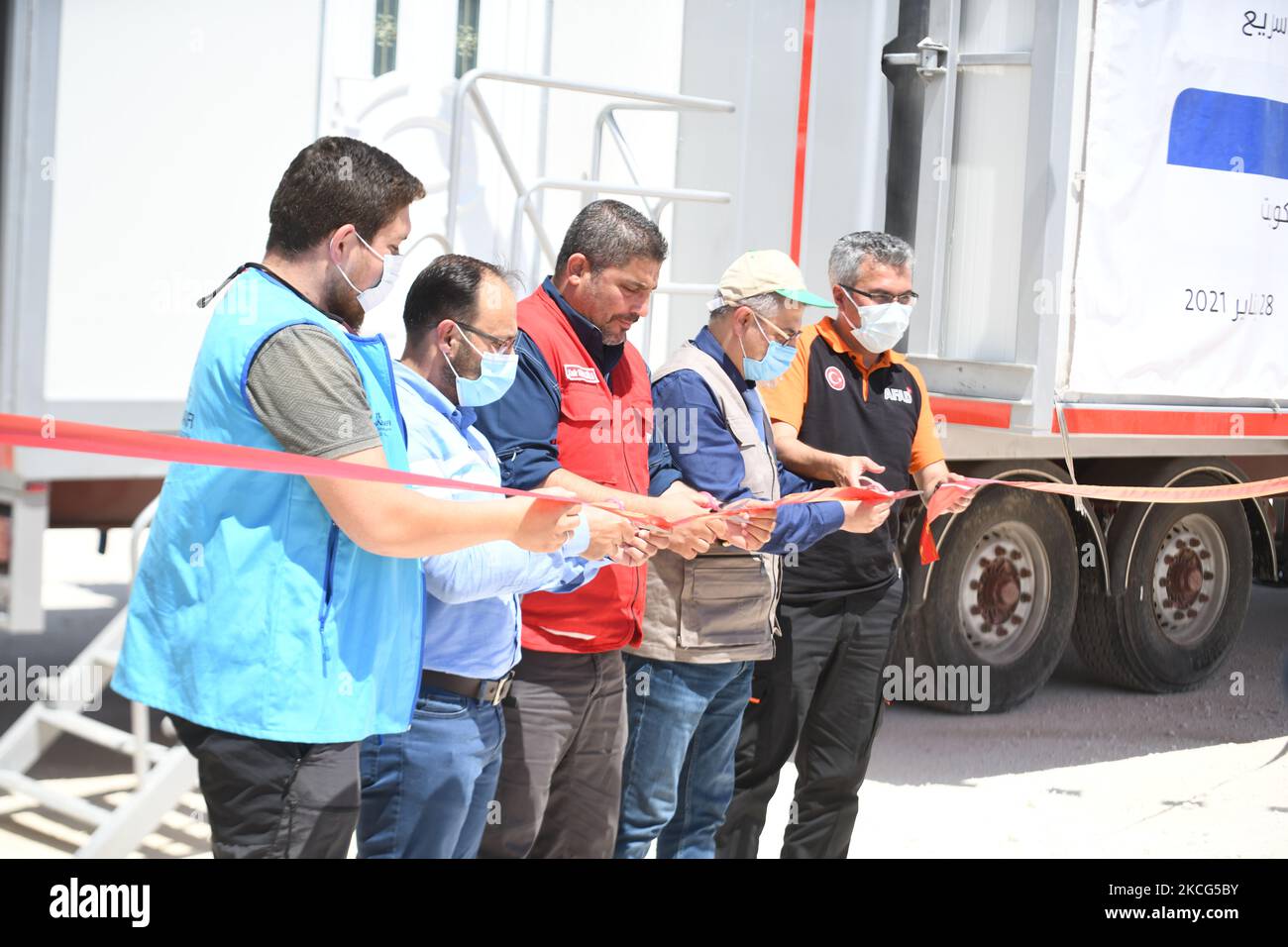 The Syrian Expatriates Medical Association ''Sima'' opened the first two mobile health centers in Idlib, Syria, on June 15, 2021 in the presence of Dr. ''Ahmed Samer Al-Esh'' CEO of Sima, Mr. ''Kadir Kemaloglu'' coordinator of the Turkish Red Crescent in Idlib, and Mr. ''Arjan Akar'', director of AFAD in the Turkish state of Hatay Mr. ''Ismail Yeket'' the official of the Turkish Religious Endowment, and Dr. ''Salem Abdan'' the director of Idlib Health. Stock Photo